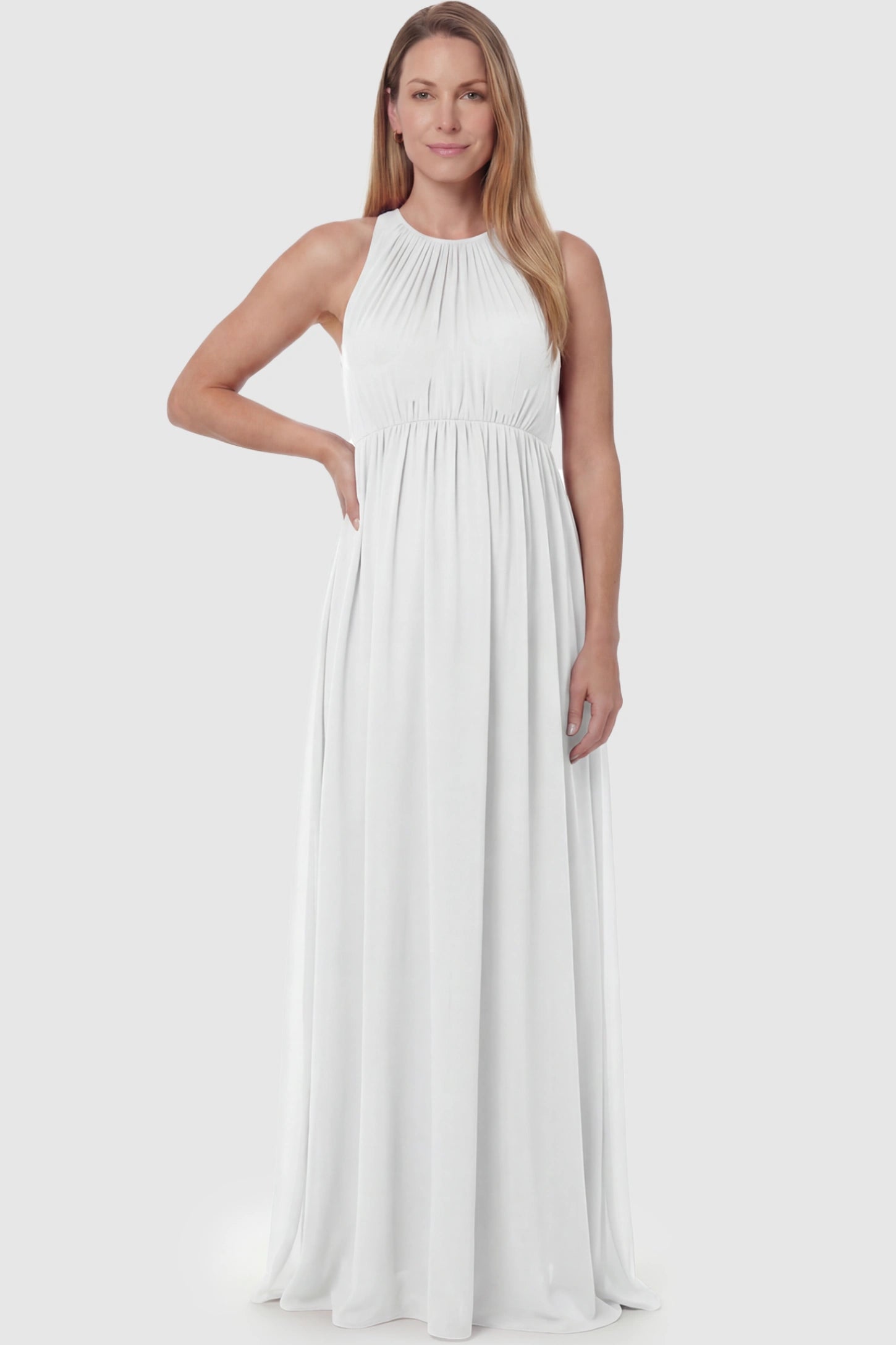 Pleated Mesh Sleeveless Maternity Photoshoot Dress Pleated Mesh Sleeveless Maternity Maxi Dress in white featuring an empire waist on a postpartum model.