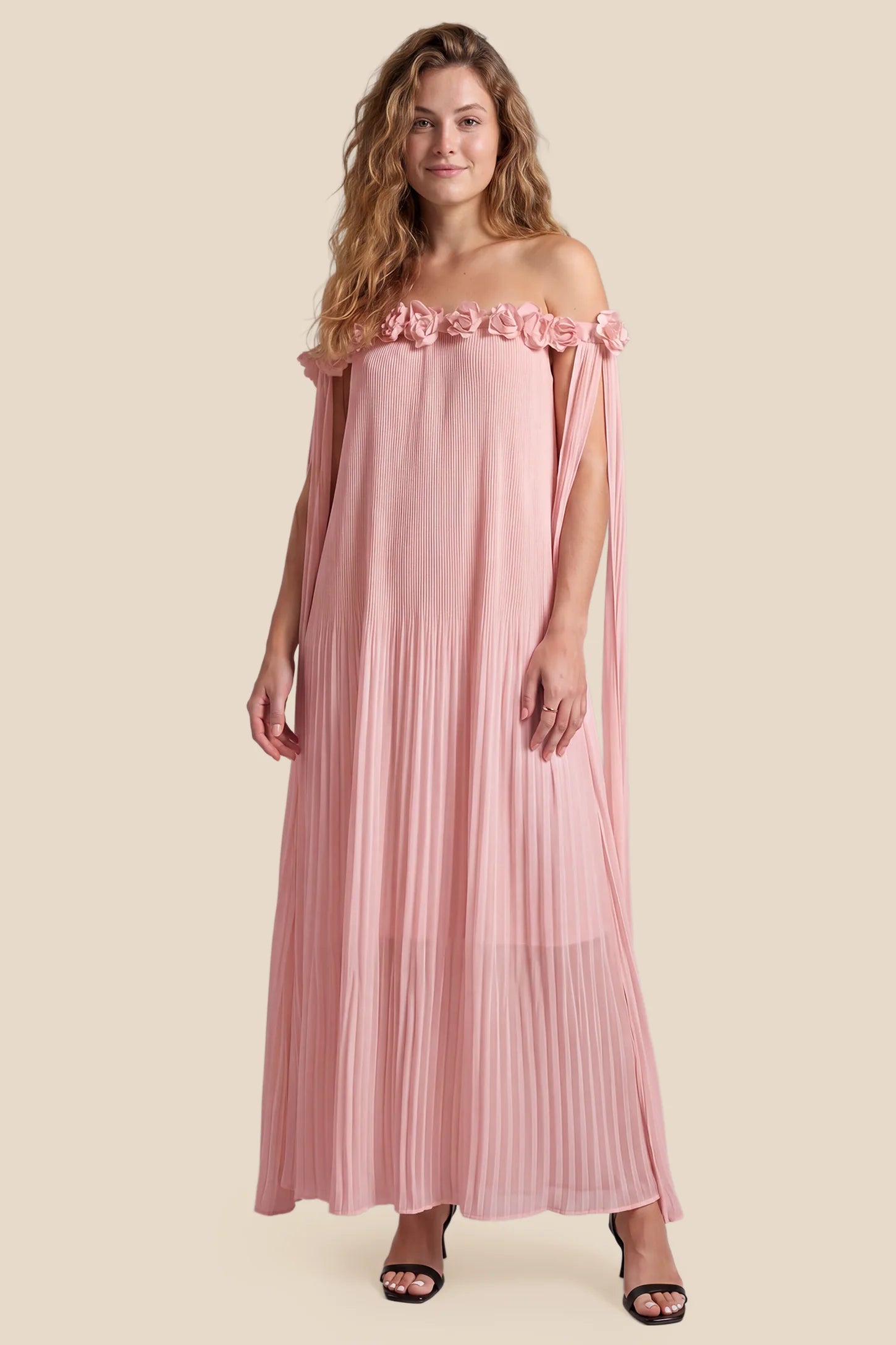 Pleated Off-Shoulder Maternity Gown with Rosettes Pleated Off-Shoulder Maternity Gown with Rosettes in Pink with romantic rosette details, front view on a non pregnant model.