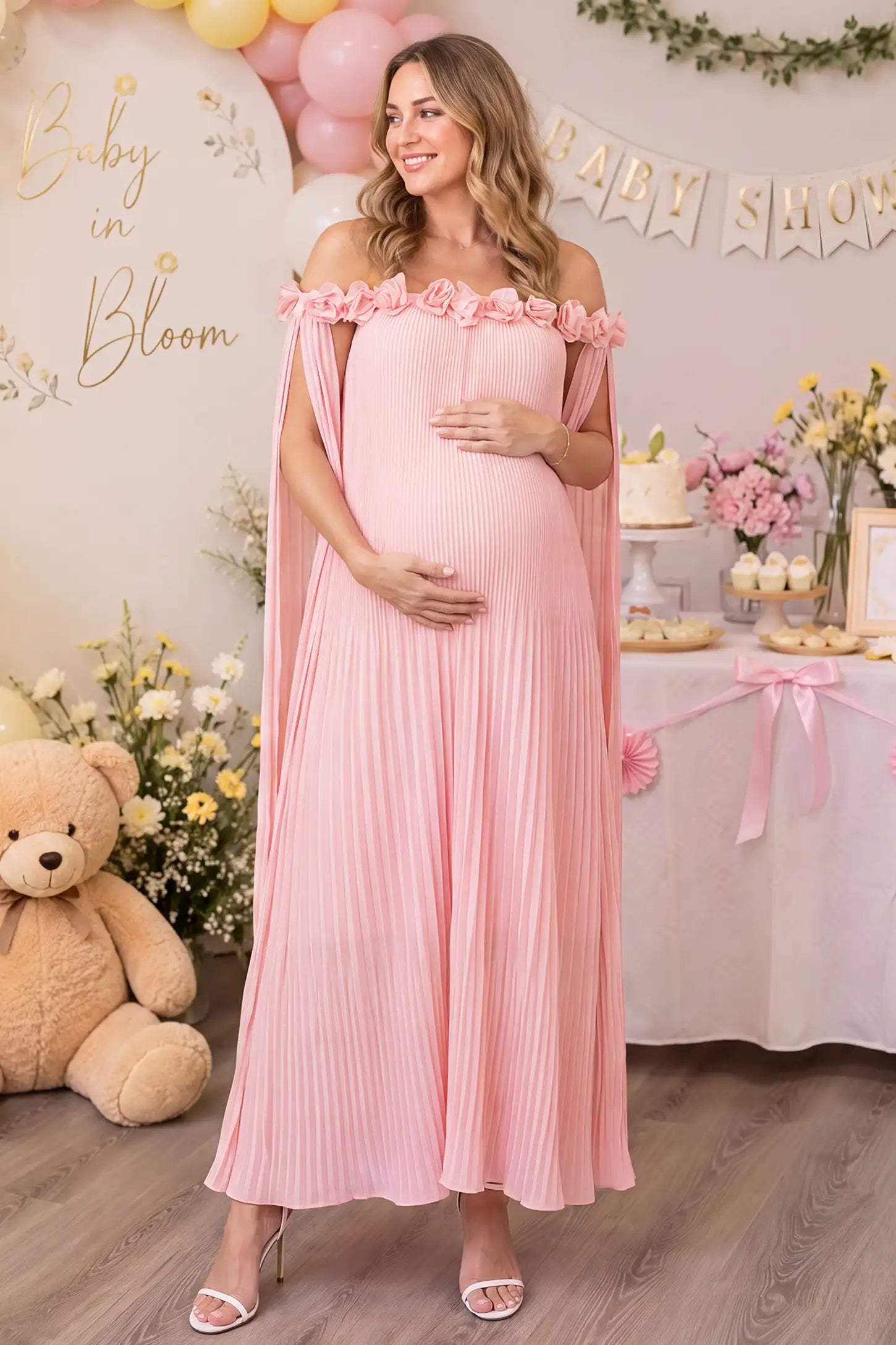 Pleated Off-Shoulder Maternity Gown with Rosettes Pleated Off-Shoulder Maternity Gown with Rosettes in Pink with pleated details, lifestyle view on a pregnant model.
