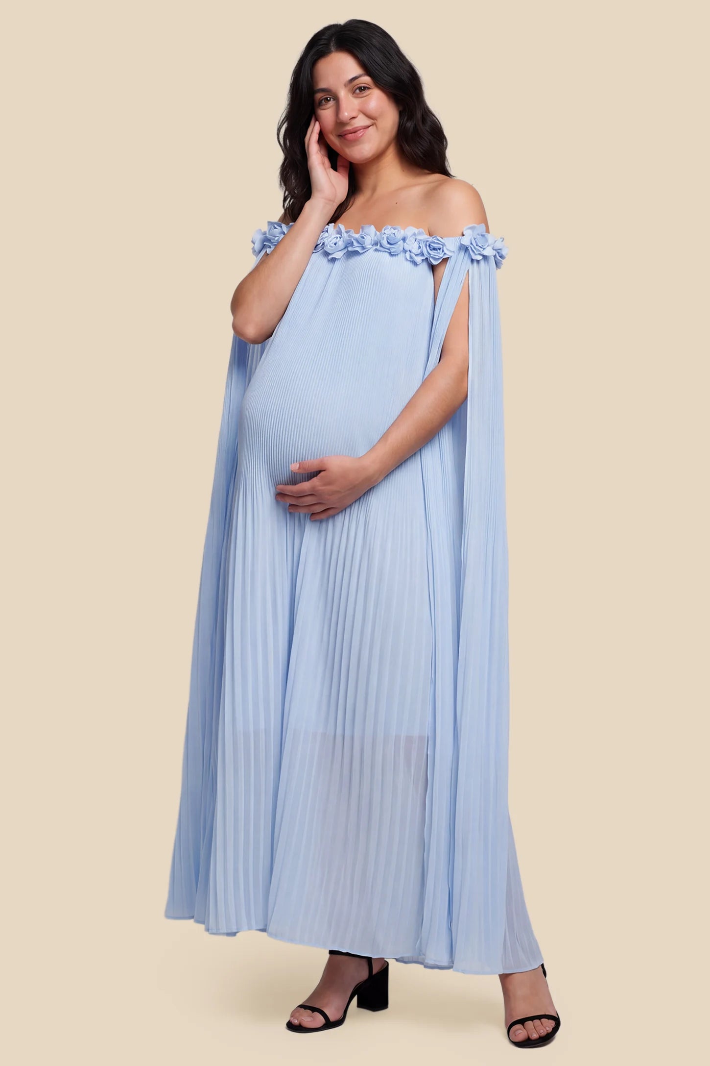 Pleated Off-Shoulder Maternity Gown with Rosettes Pleated Off-Shoulder Maternity Gown with Rosettes in Skye Blue featuring an off-shoulder neckline and rosette accents, front view on a pregnant model.