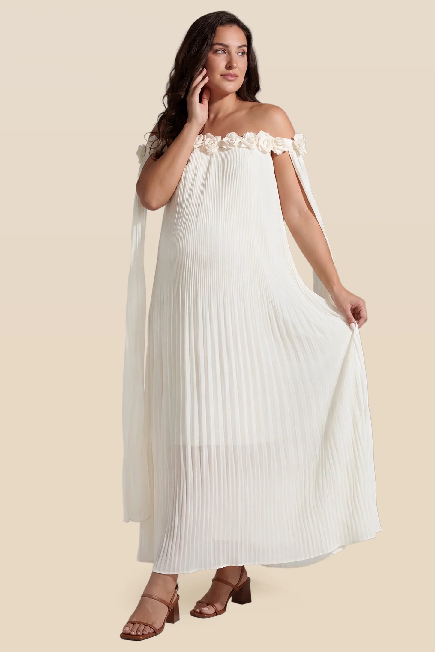 Pleated Off-Shoulder Maternity Gown with Rosettes Pleated Off-Shoulder Maternity Gown with Rosettes in White with romantic rosette details, front view on a plus-size model.