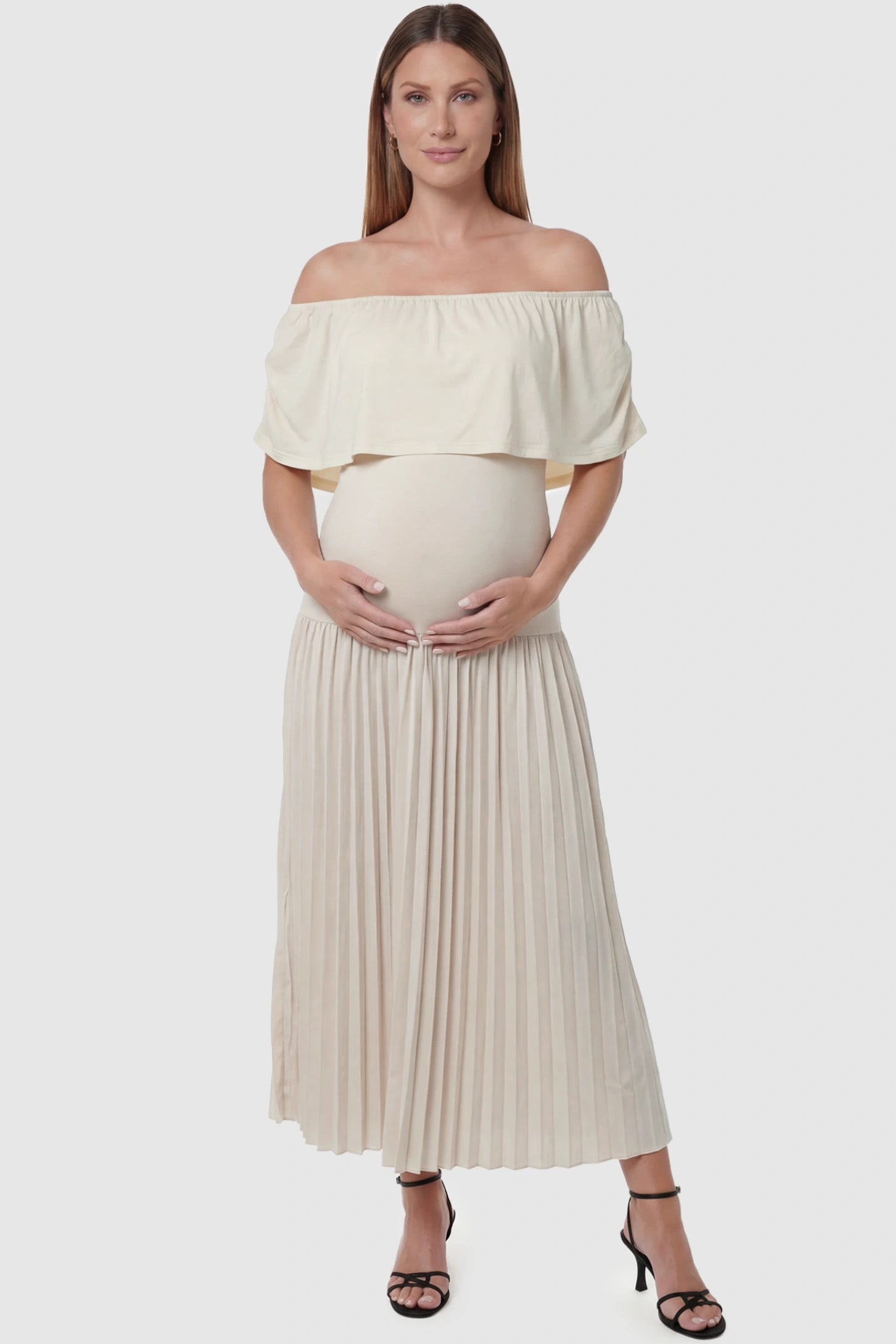 Pleated Off Shoulder Maternity Maxi Dress  in Beige featuring high stretch pleated maxi skirt on a pregnant model front view.