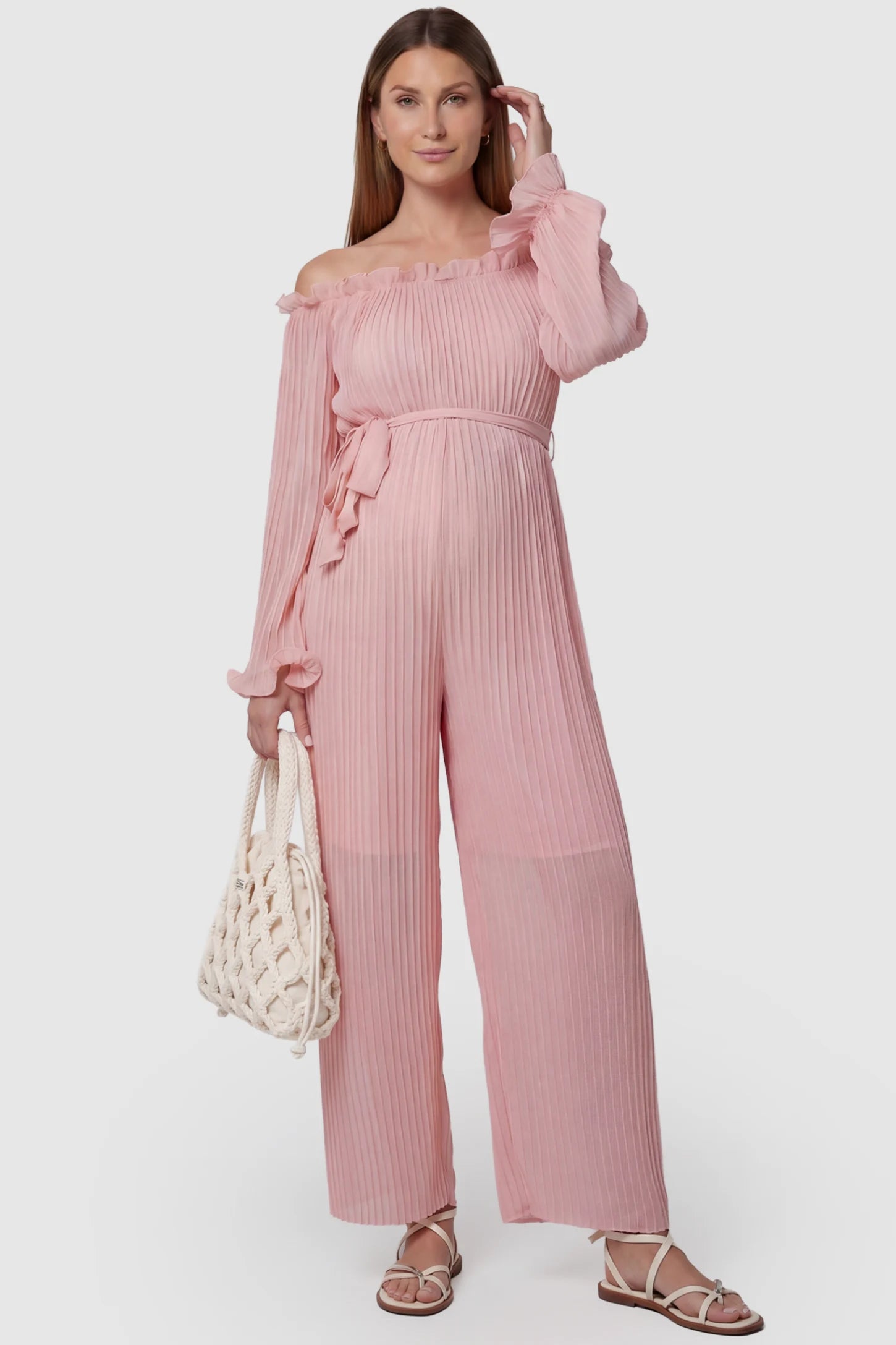 Pleated Off Shoulder Tie-Waist Maternity Jumpsuit in Pink featuring a wide-leg silhouette on a pregnant model, front view.