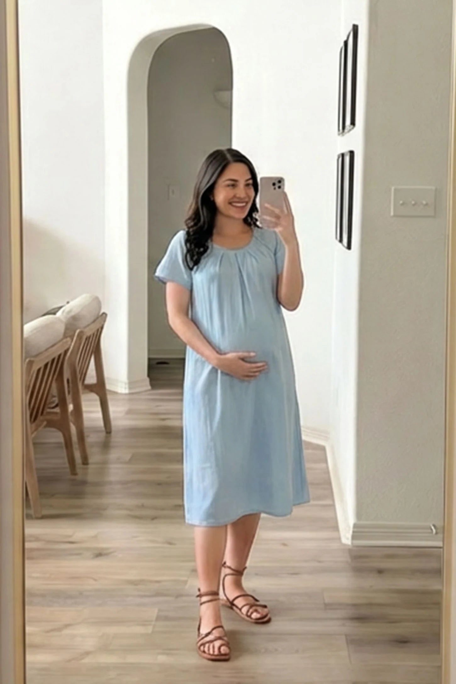 Pleated Round Neck Flowy Midi Maternity Dress Pleated Round Neck Flowy Midi Maternity Dress in Blue featuring comfortable short sleeves on a pregnant model, mirror selfie.