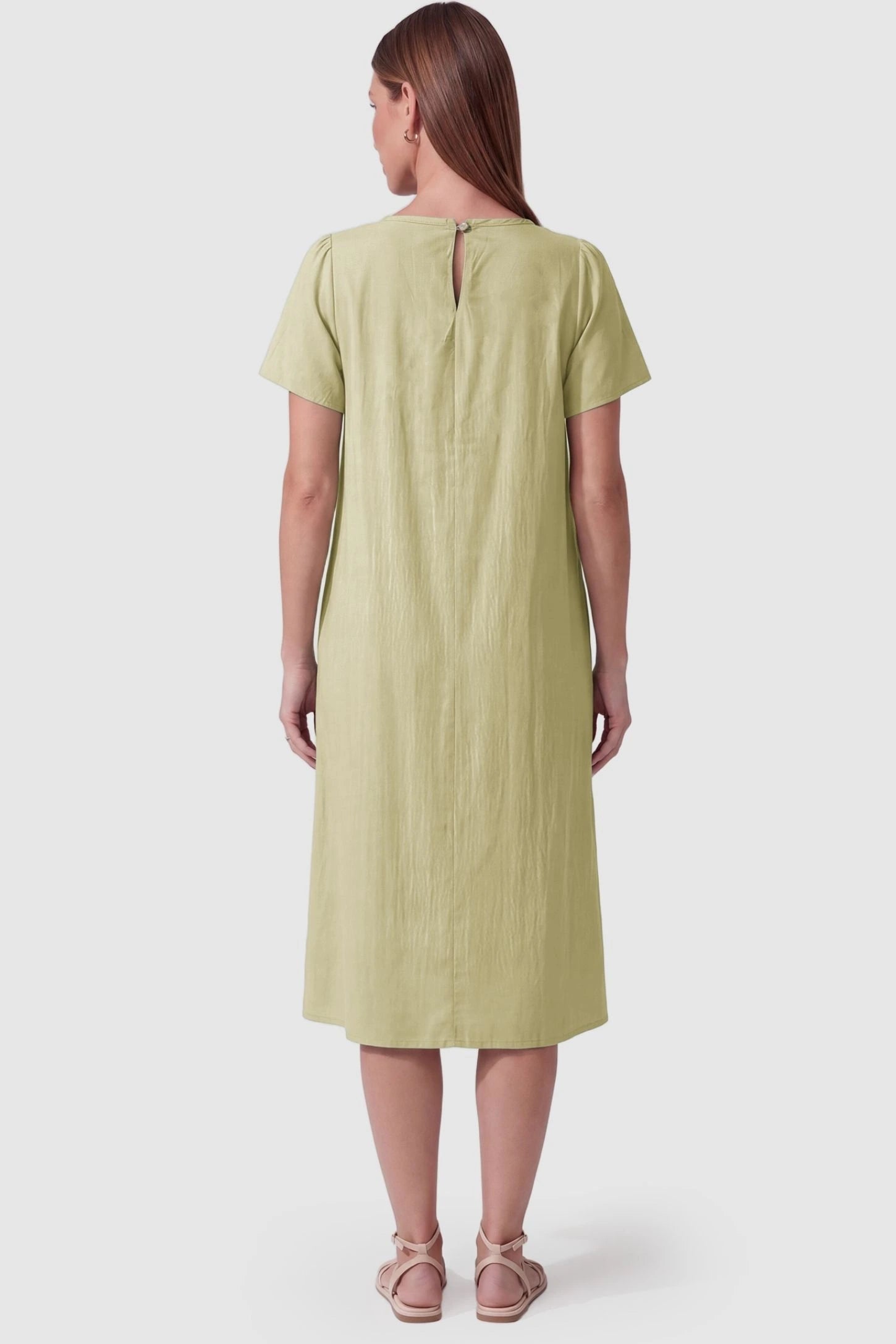 Pleated Round Neck Flowy Midi Maternity Dress Pleated Round Neck Flowy Midi Maternity Dress in Light Green featuring a keyhole back closure on a pregnant model, back view.