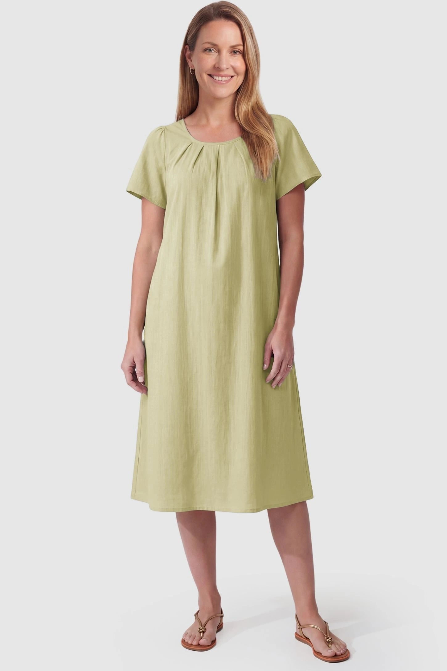 Pleated Round Neck Flowy Midi Maternity Dress Pleated Round Neck Flowy Midi Maternity Dress in Light Green featuring a versatile drape on a postpartum model, front view.
