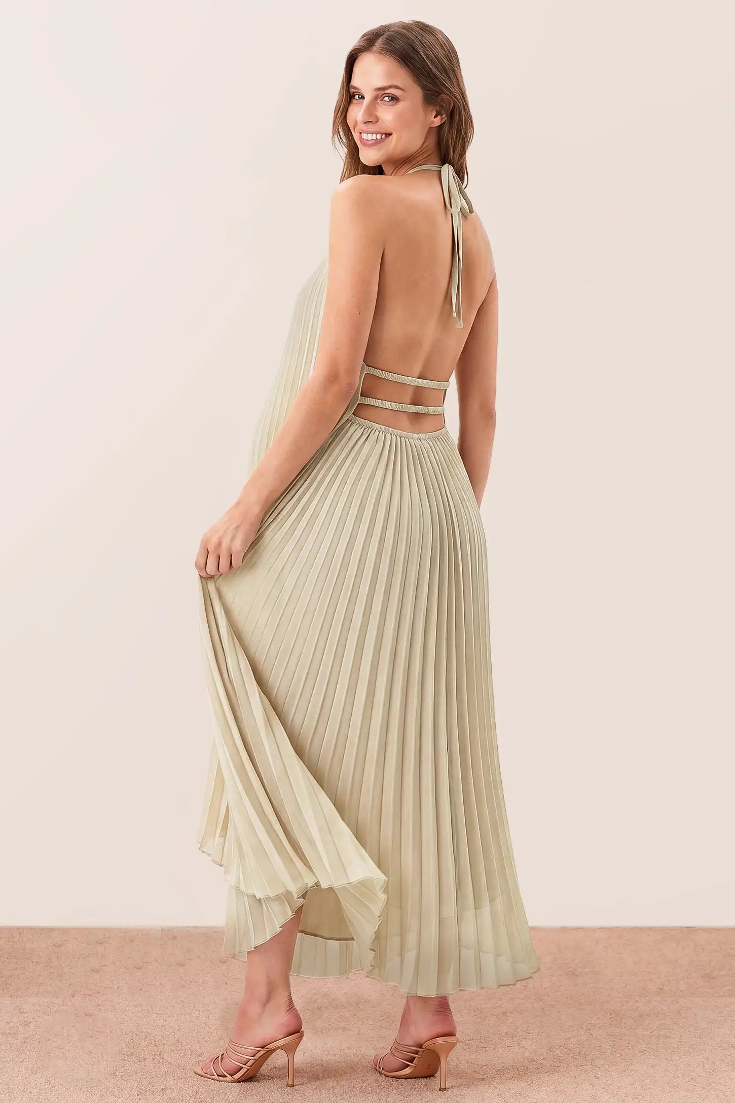 Pleated Tiered Halter Maxi Maternity Gown Pleated Tiered Halter Maxi Maternity Gown in Soft Sage showcasing an open back design, back view on a pregnant model.