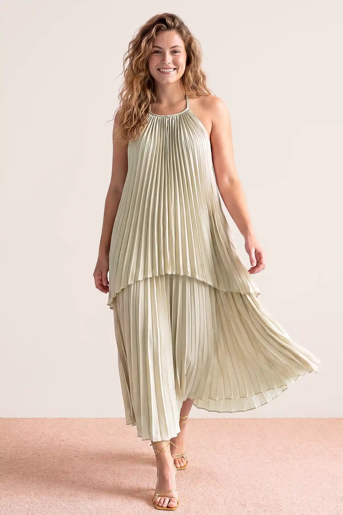 Pleated Tiered Halter Maxi Maternity Gown Pleated Tiered Halter Maxi Maternity Gown in Soft Sage with elegant pleats, front view on a non pregnant model.