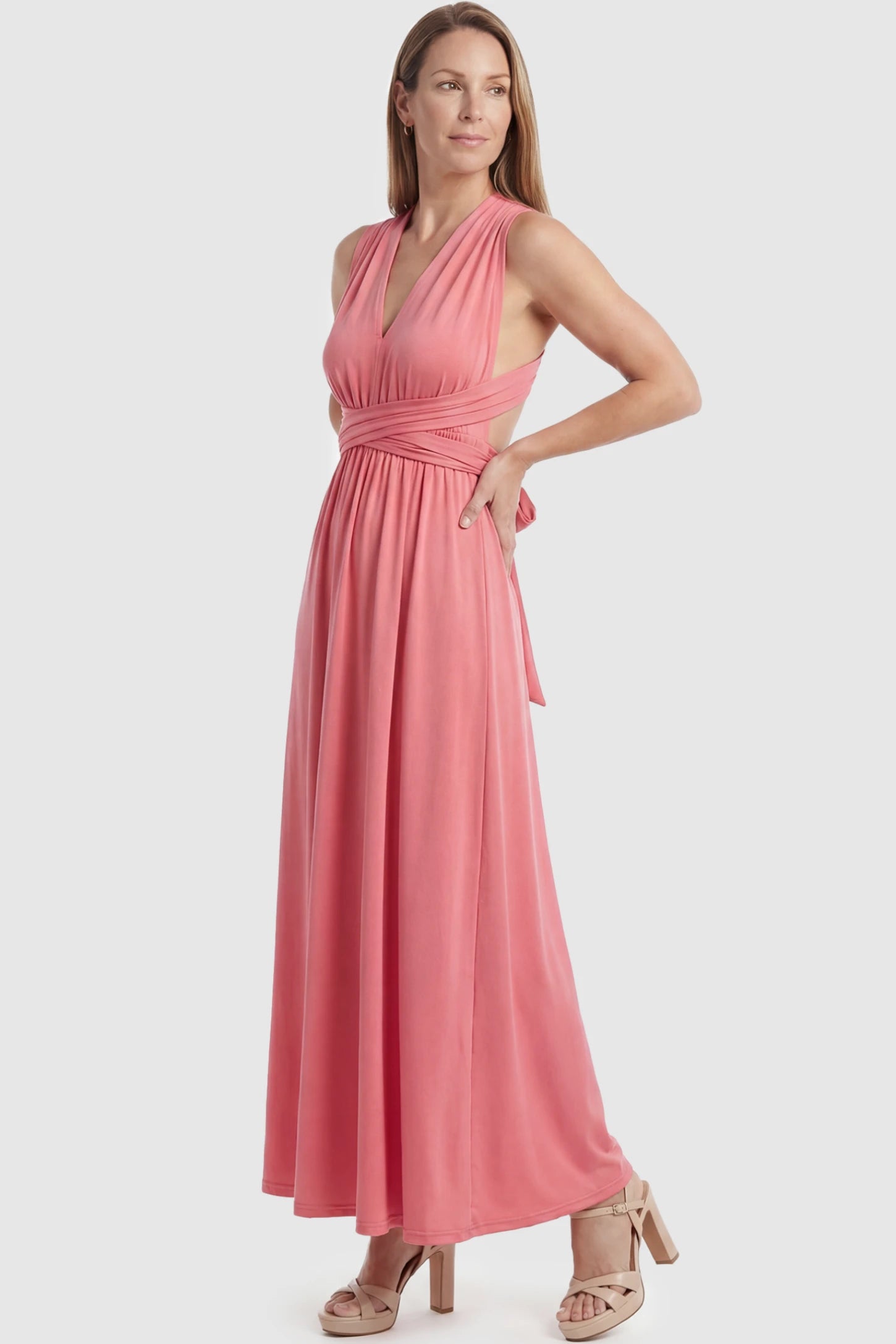 Plunging Halter Empire Waist Maternity Maxi Dress Plunging Halter Empire Waist Maternity Maxi Dress in Pink featuring high-stretch fabric on a postpartum model in a studio setting showing front.