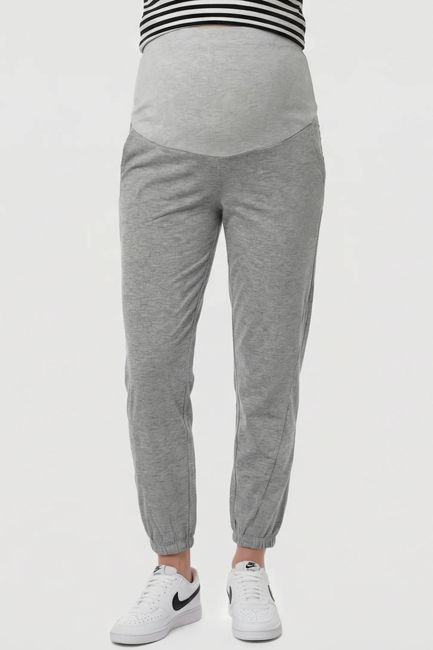Full Panel Pocketed Maternity Jogger Pants Full Panel Pocketed Maternity Jogger Pants in Light Gray featuring a jersey belly panel on a pregnant model, front view.