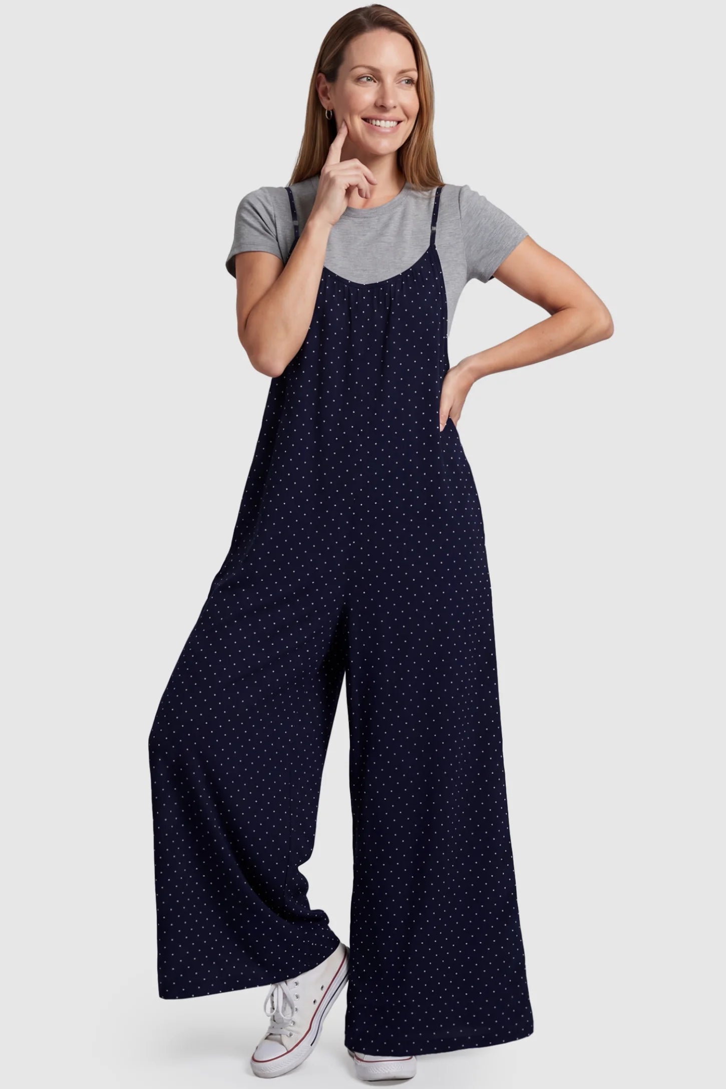 Pocketed Spaghetti Strap Wide Leg Maternity Jumpsuit Pocketed Spaghetti Strap Wide Leg Maternity Jumpsuit in Blue featuring loose fitting silhouette and pockets on a postpartum model, front view.