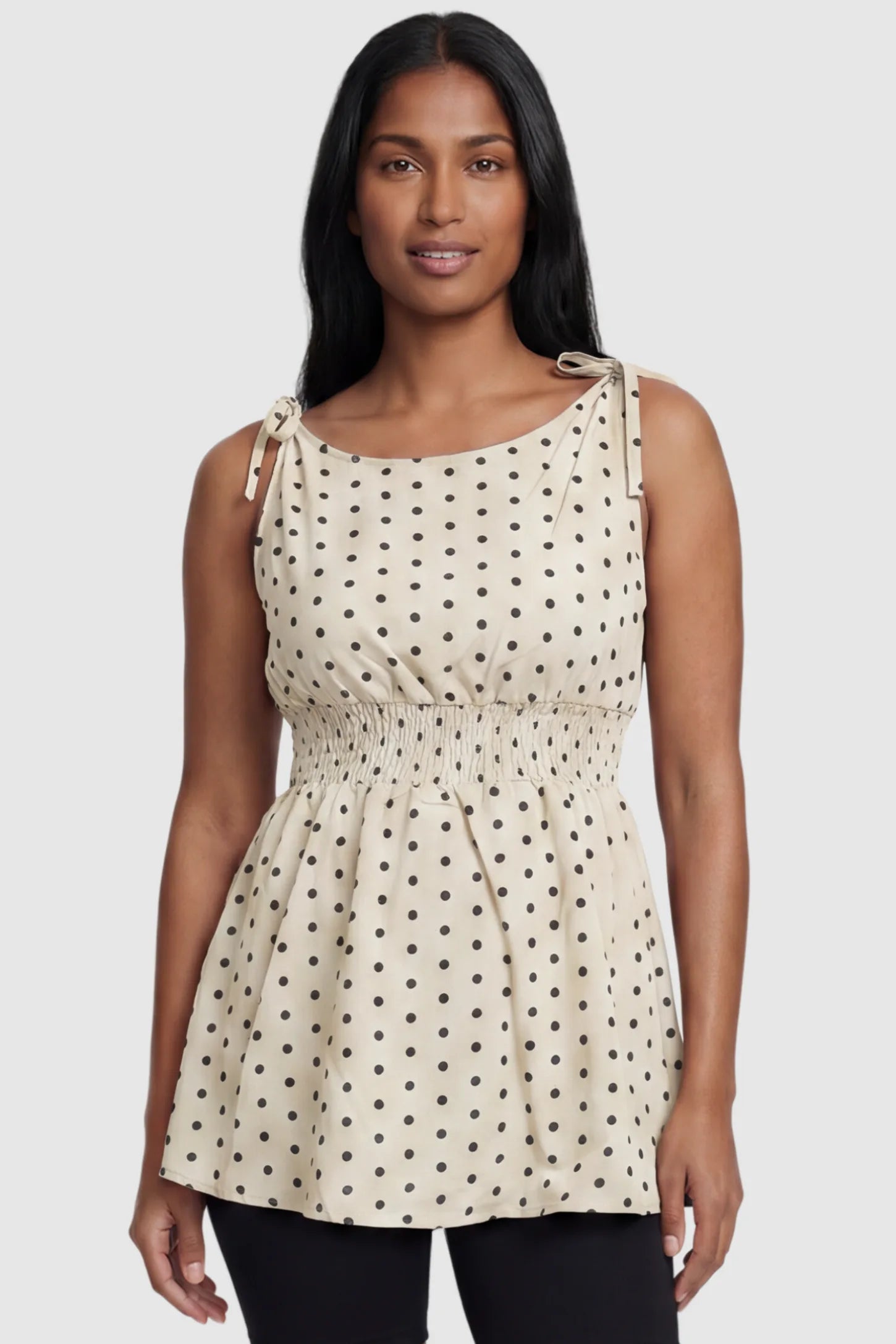 Polka Dot Round Neck Flowy Maternity Top Polka Dot Flowy Maternity Top in Beige featuring a smocked elastic waistband and shoulder ties on a postpartum model, front view.