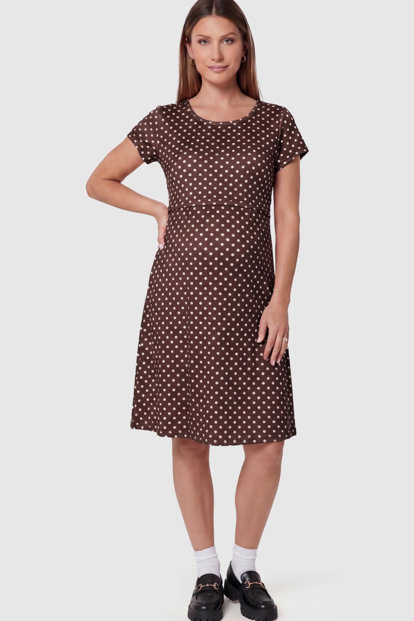 Polka Dot Scoop Neck Maternity Nursing Dress Polka Dot Scoop Neck Midi Maternity Nursing Dress in brown featuring a discreet lift-up layer on a pregnant model showing front.