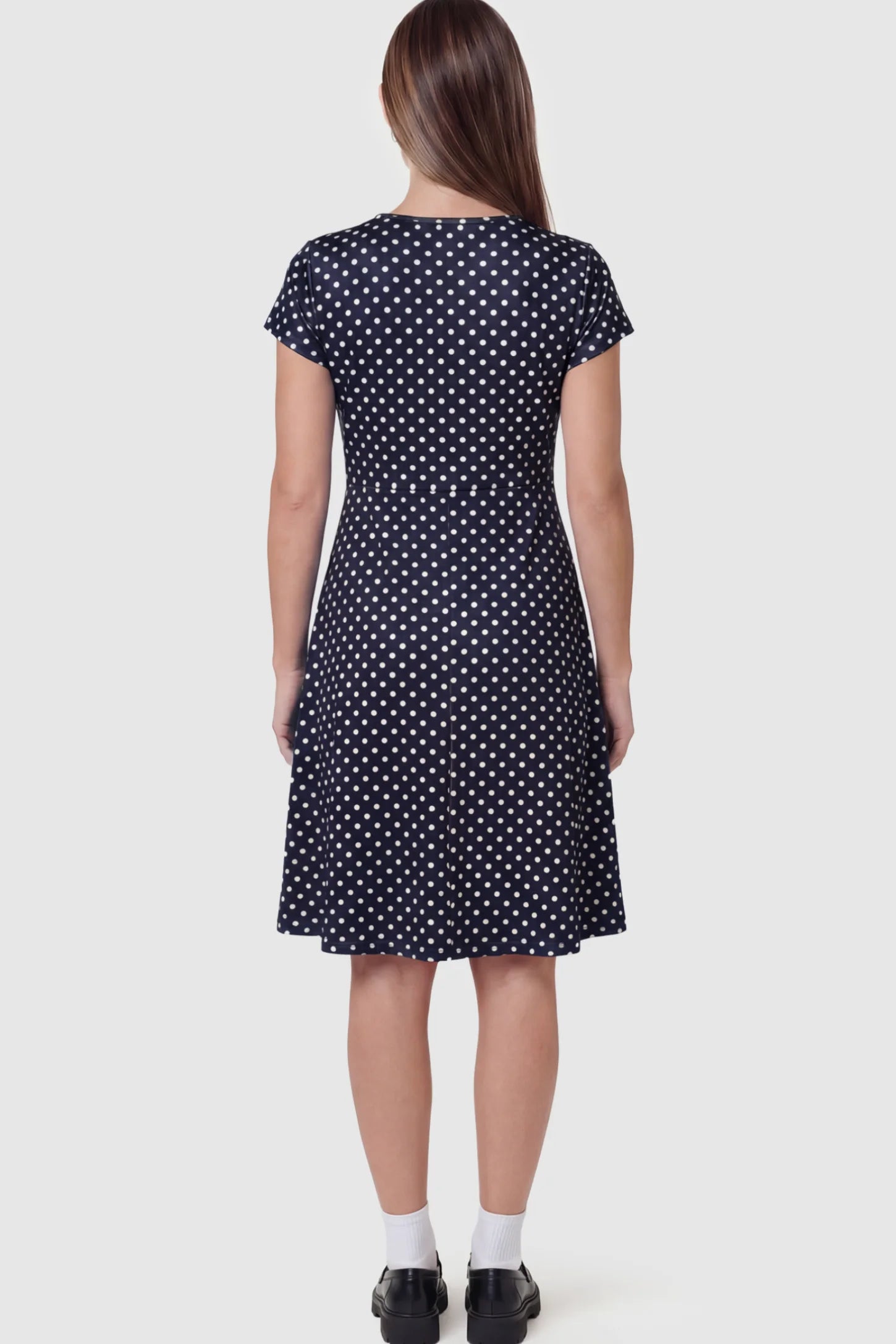 Polka Dot Scoop Neck Maternity Nursing Dress Polka Dot Scoop Neck Midi Maternity Nursing Dress in Navy blue featuring short sleeves on a pregnant model showing back.