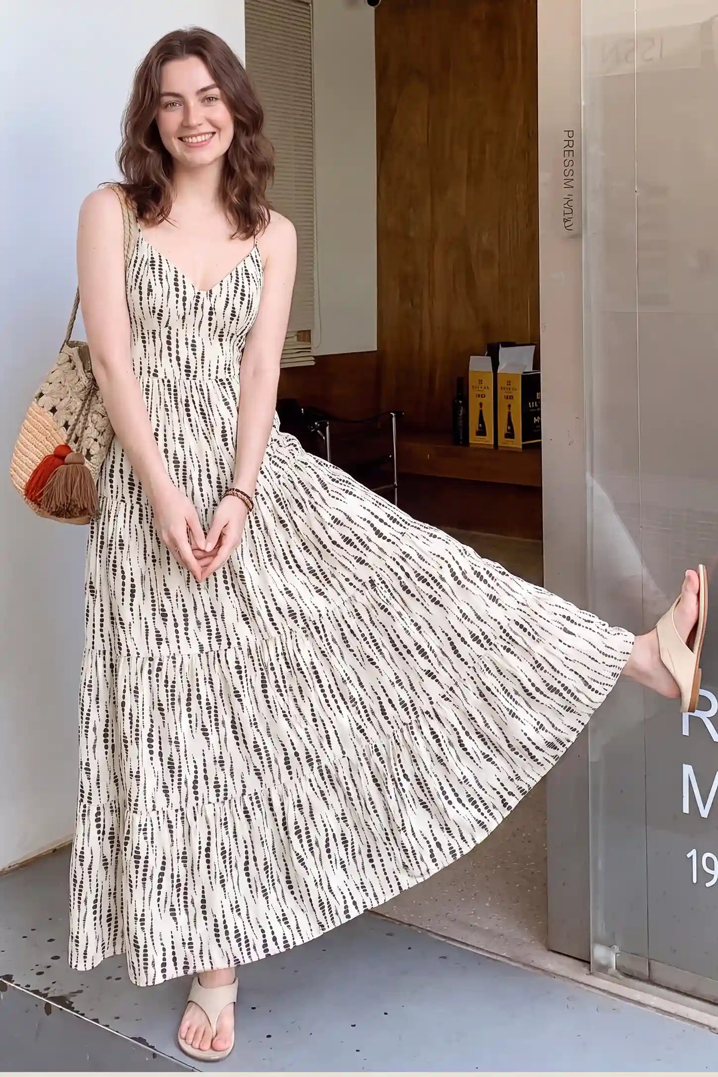 Print Tiered Cami Maternity Maxi Dress Print Tiered Cami Maternity Maxi Dress in Ivory Dash Print with printed tiered design, lifestyle view on a non pregnant model.