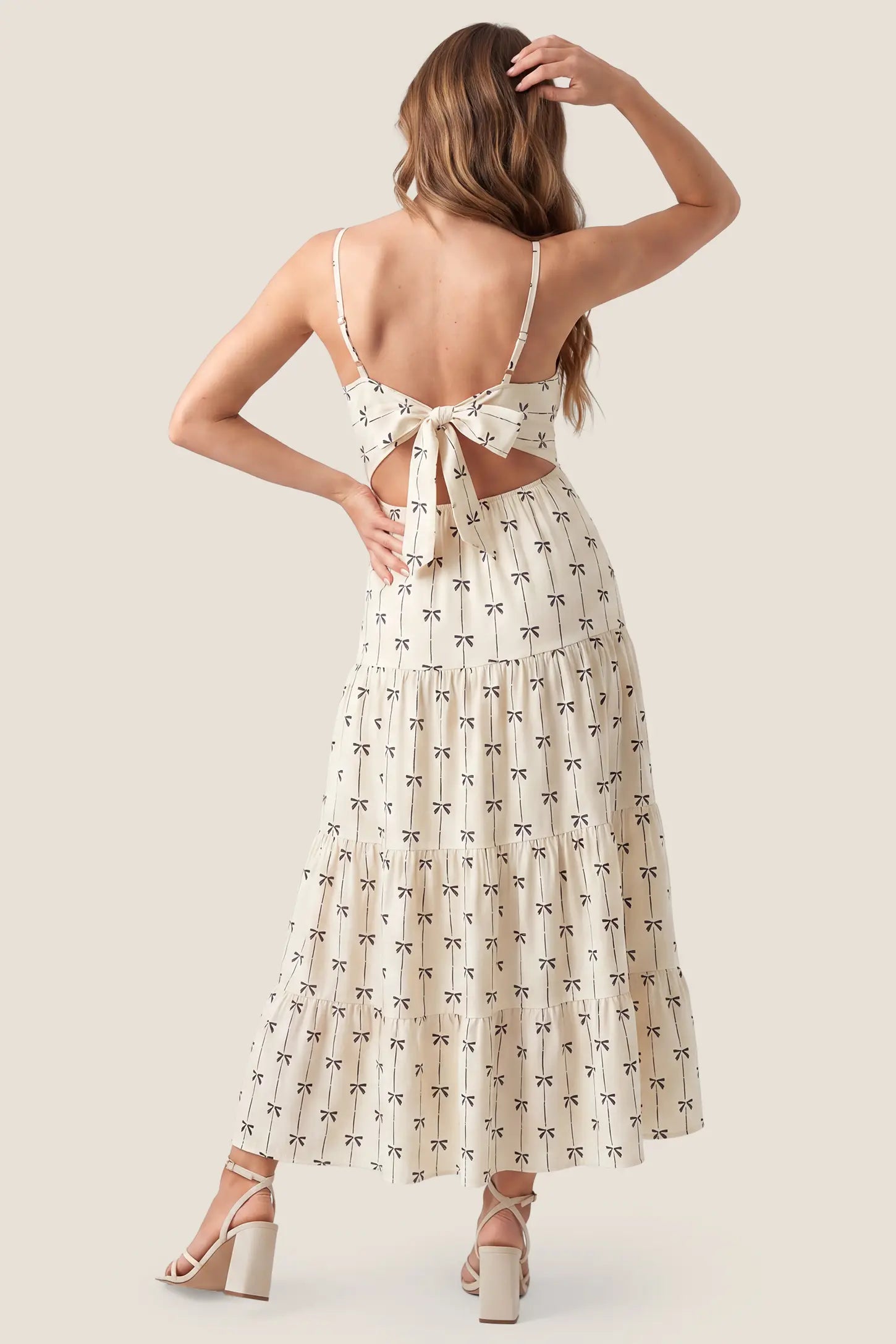Print Tiered Cami Maternity Maxi Dress Print Tiered Cami Maternity Maxi Dress in Khaki showcasing the flowy tiered back drape, back view on a pregnant model.