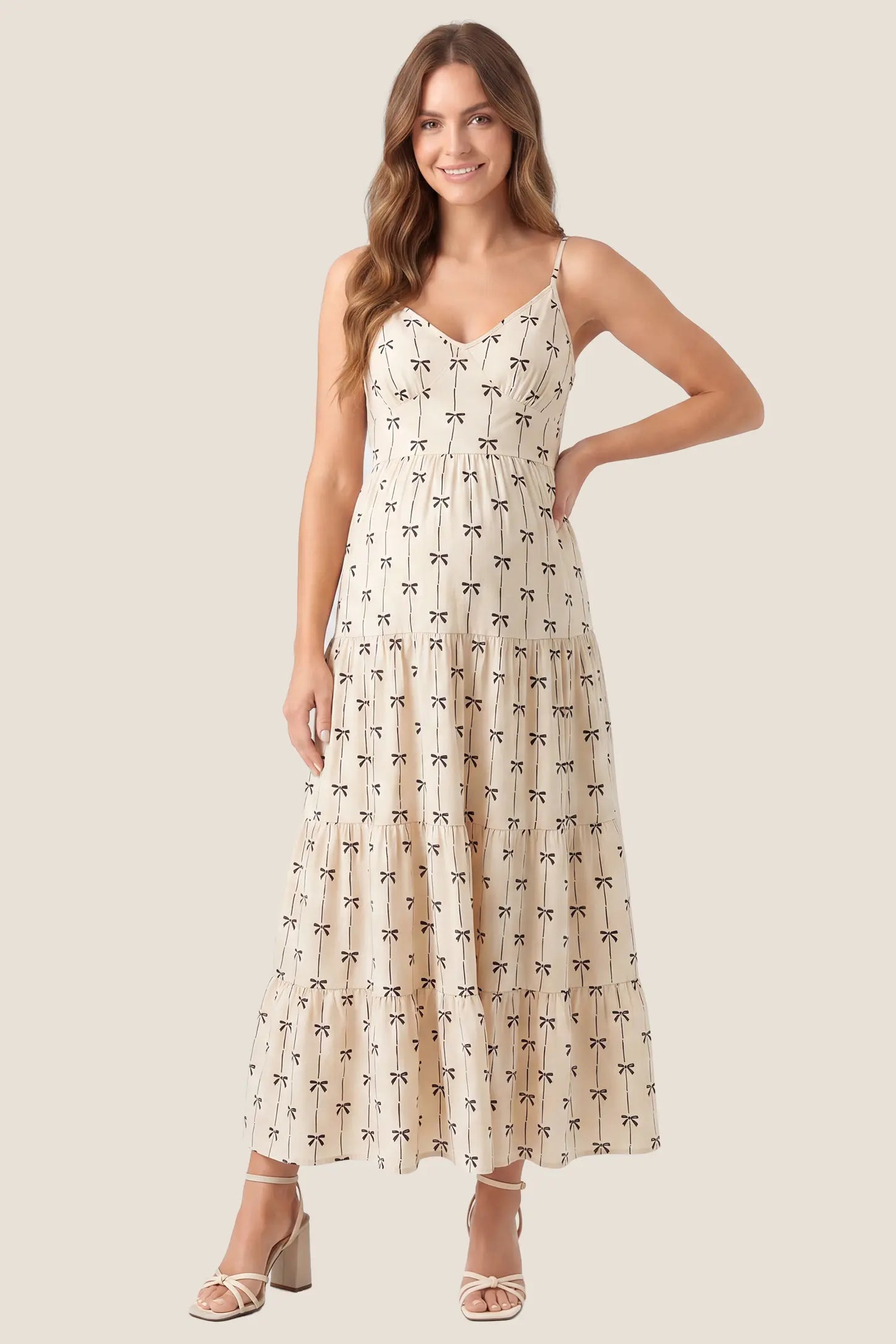 Print Tiered Cami Maternity Maxi Dress Print Tiered Cami Maternity Maxi Dress in Khaki featuring cami straps and a tiered maxi skirt, front view on a pregnant model.