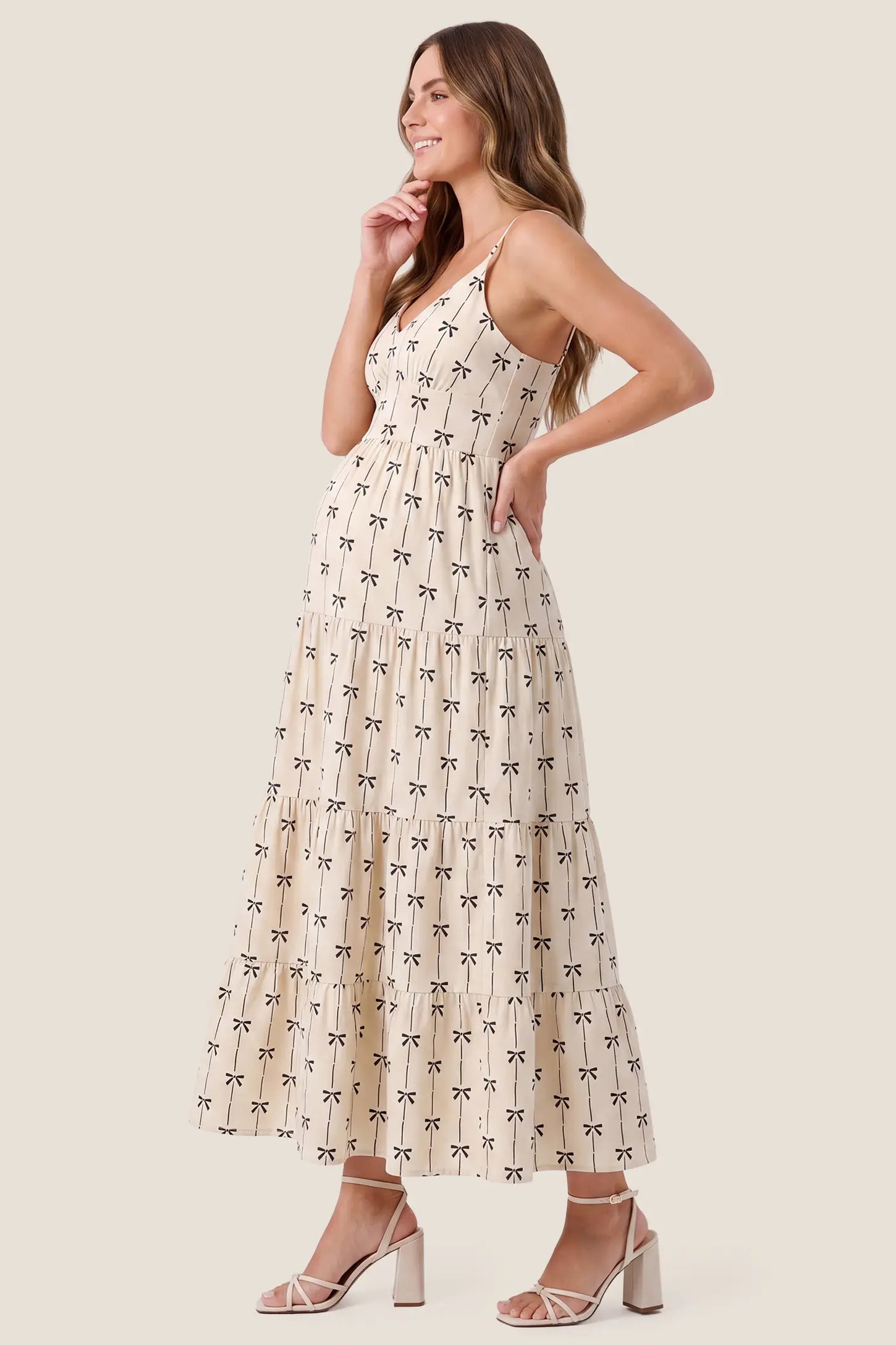 Print Tiered Cami Maternity Maxi Dress Print Tiered Cami Maternity Maxi Dress in Khaki with an accommodating tiered silhouette, side view on a pregnant model