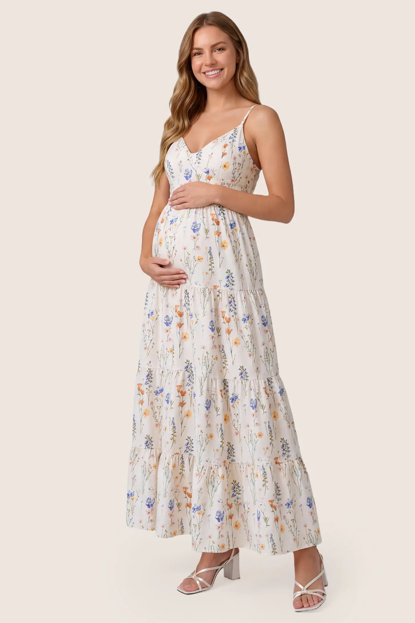 Print Tiered Cami Maternity Maxi Dress Print Tiered Cami Maternity Maxi Dress in White with a clean front view showcasing the V-neckline and print on a pregnant model.