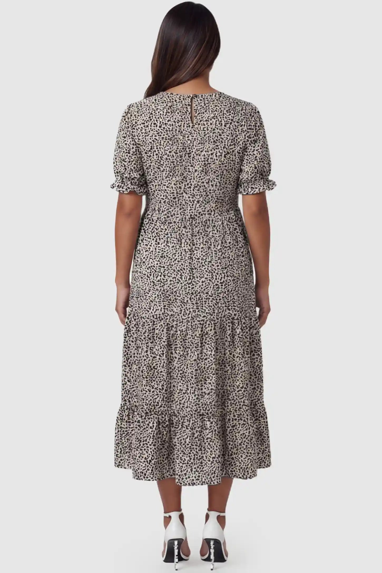 Printed Short Sleeve Tiered Maternity Midi Dress Printed Short Sleeve Tiered Maternity Midi Dress in apricot featuring round neck, tiered A-line skirt on a pregnant model, back view.