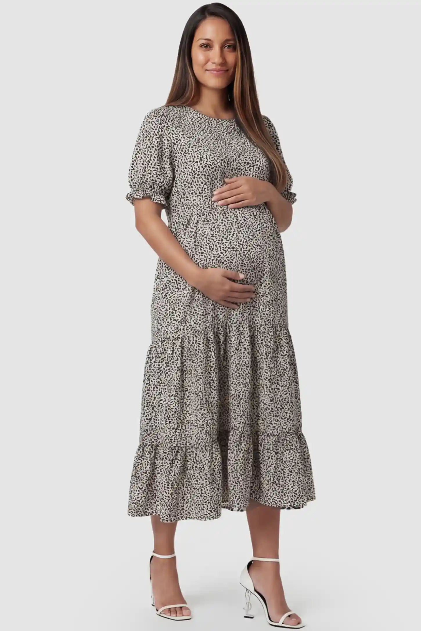 Printed Short Sleeve Tiered Maternity Midi Dress Printed Short Sleeve Tiered Maternity Midi Dress in apricot featuring round neck, tiered A-line skirt on a pregnant model, front view.