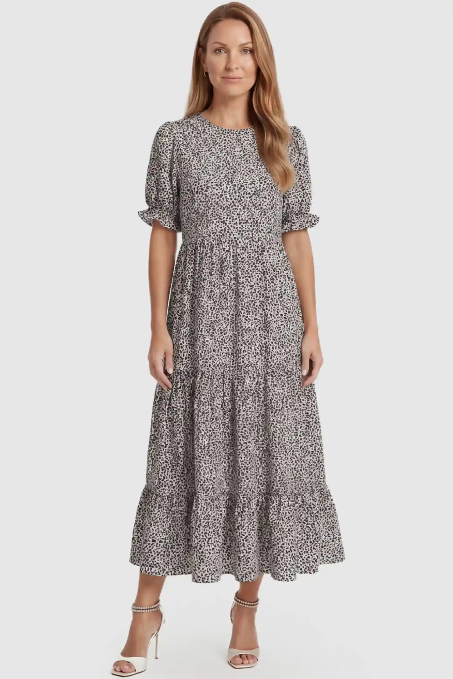 Printed Short Sleeve Tiered Maternity Midi Dress Printed Short Sleeve Tiered Maternity Midi Dress in apricot featuring round neck, tiered A-line skirt on a postpartum model, front view.