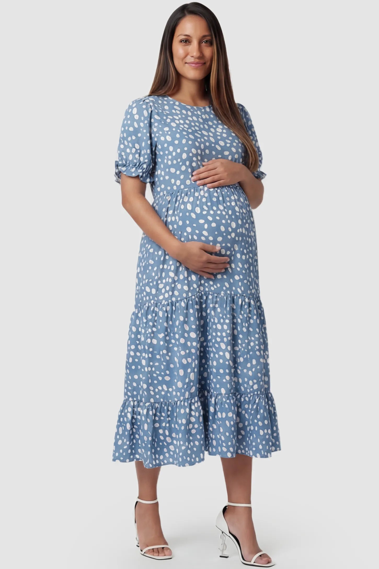 Printed Short Sleeve Tiered Maternity Midi Dress Printed Short Sleeve Tiered Maternity Midi Dress in light blue featuring round neck, tiered A-line skirt on a pregnant model, front view.
