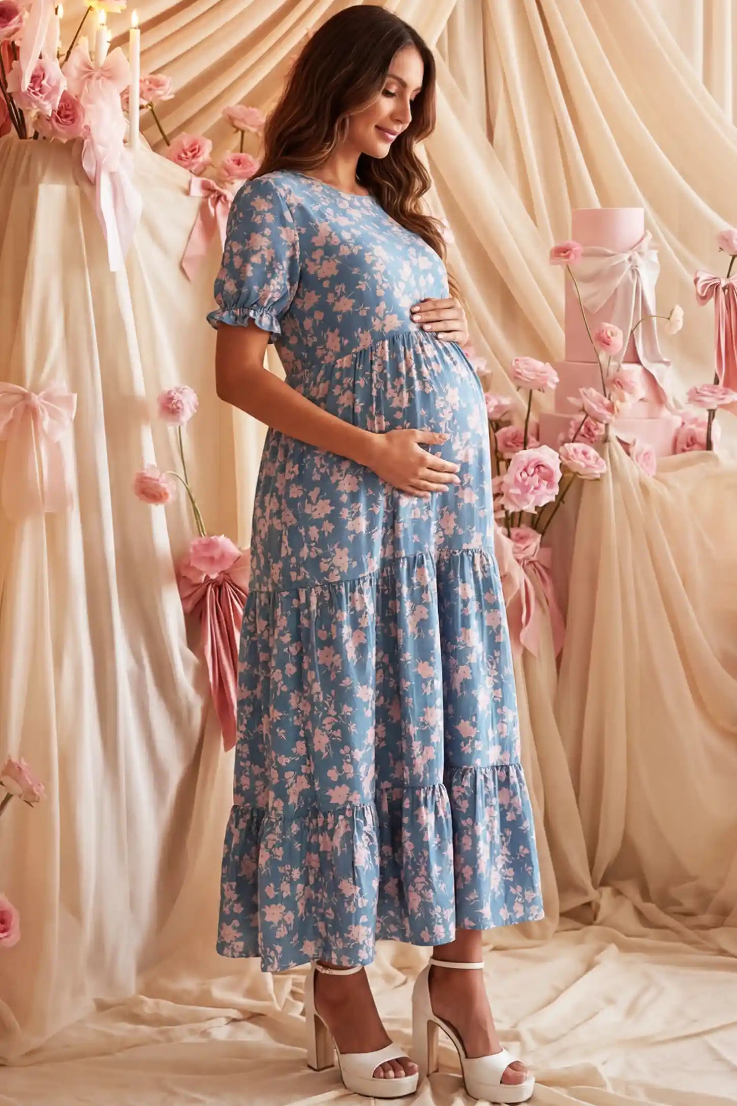 Printed Short Sleeve Tiered Maternity Midi Dress Printed Short Sleeve Tiered Maternity Midi Dress in ocean blue featuring round neck, tiered A-line skirt on a pregnant woman in indoor setting, side view.