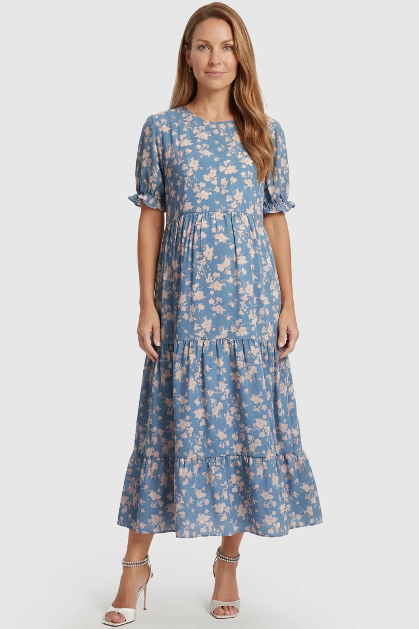 Printed Short Sleeve Tiered Maternity Midi Dress Printed Short Sleeve Tiered Maternity Midi Dress in ocean blue featuring round neck, tiered A-line skirt on a postpartum model, front view.