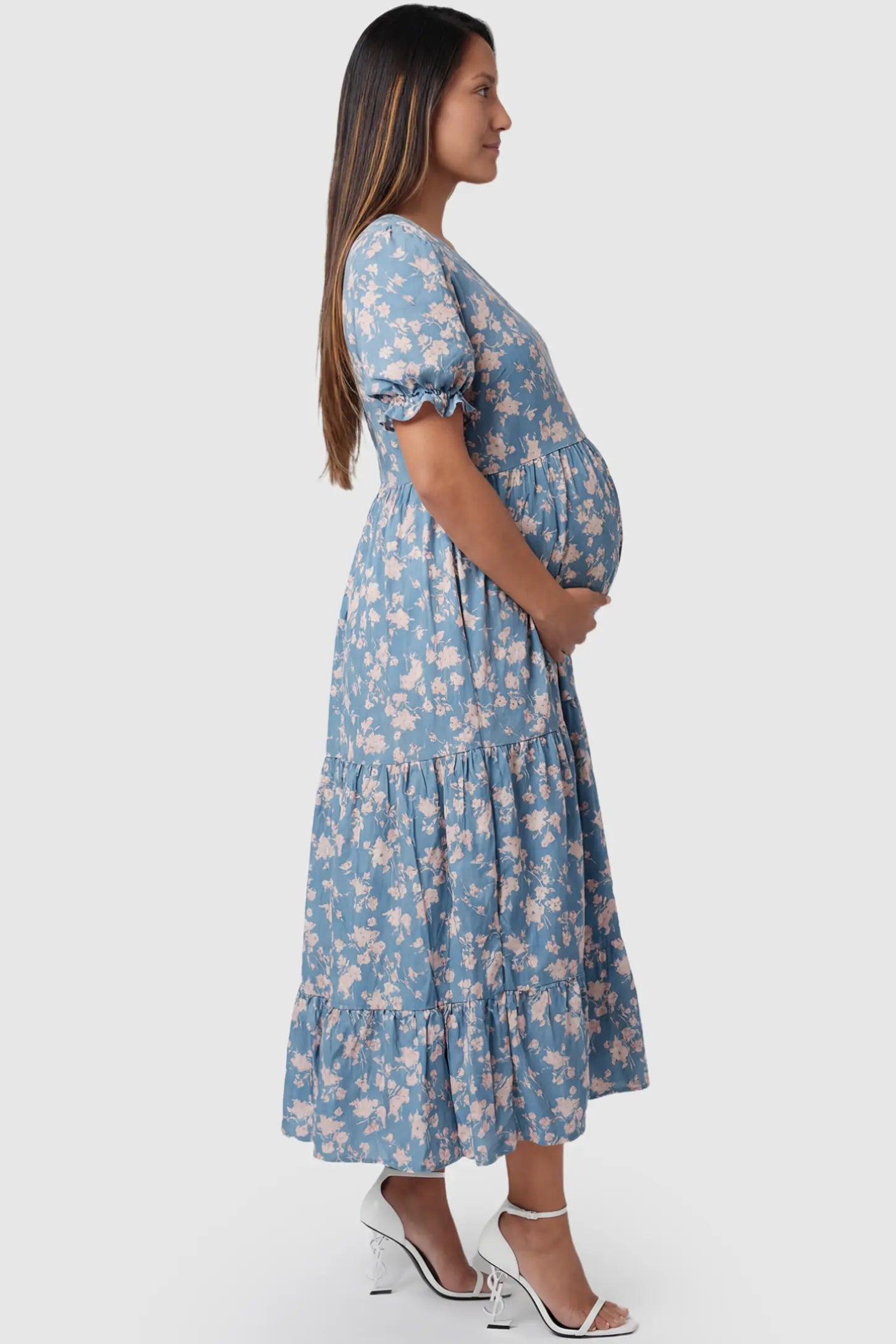 Printed Short Sleeve Tiered Maternity Midi Dress Printed Short Sleeve Tiered Maternity Midi Dress in ocean blue featuring round neck, tiered A-line skirt on a pregnant model, side view.