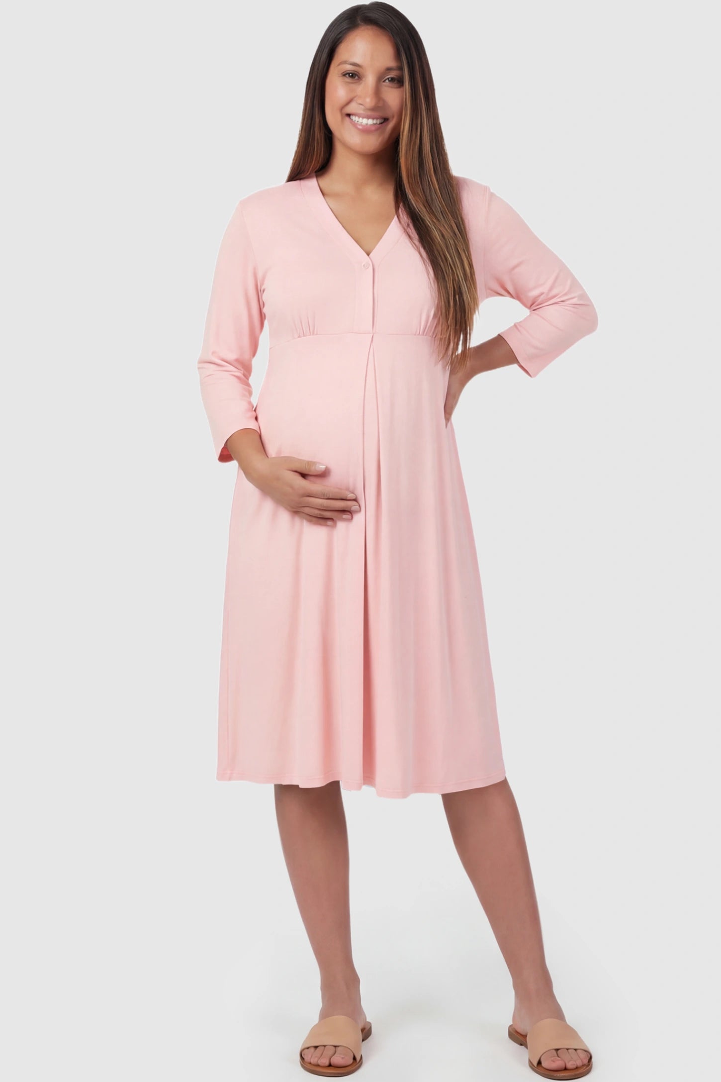 Pure Cotton V-Neck Button Front Maternity Nursing Sleepwear Pure Cotton V-Neck Button Front Maternity Nursing Dress in Pink featuring button front nursing on a pregnant model posing front.
