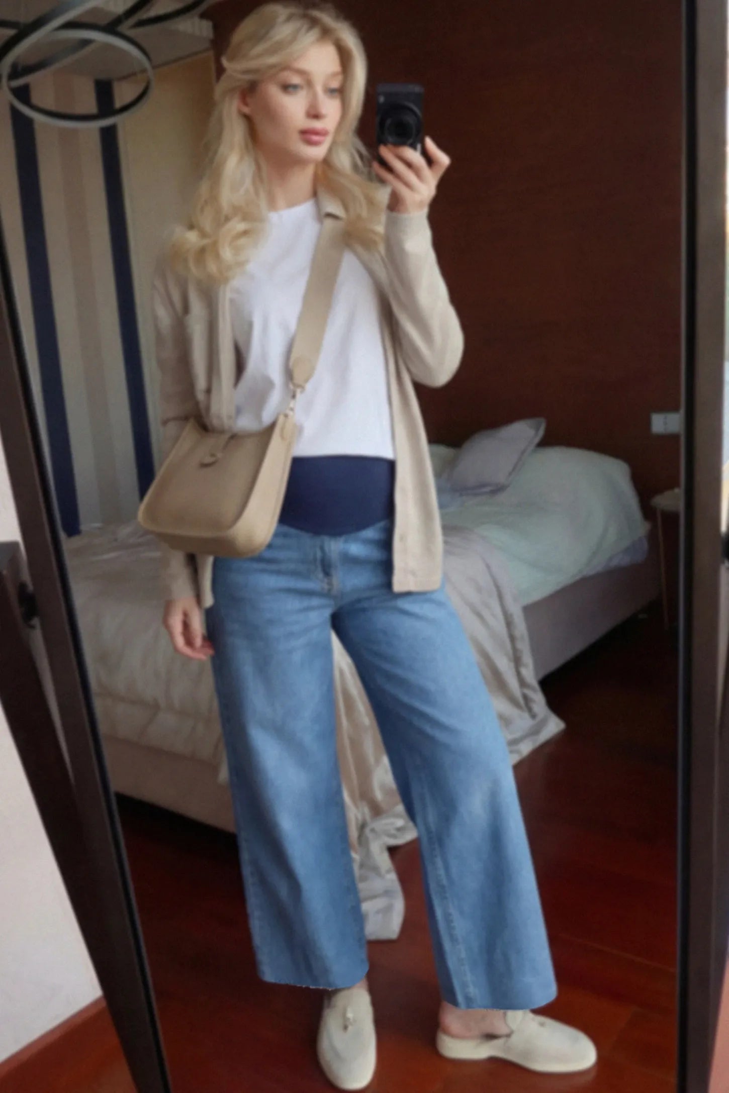 Raw Hem Full Panel Wide Leg Maternity Jeans Raw Hem Full Panel Wide Leg Maternity Jeans in dark blue featuring a high-rise navy belly band on a pregnant woman.