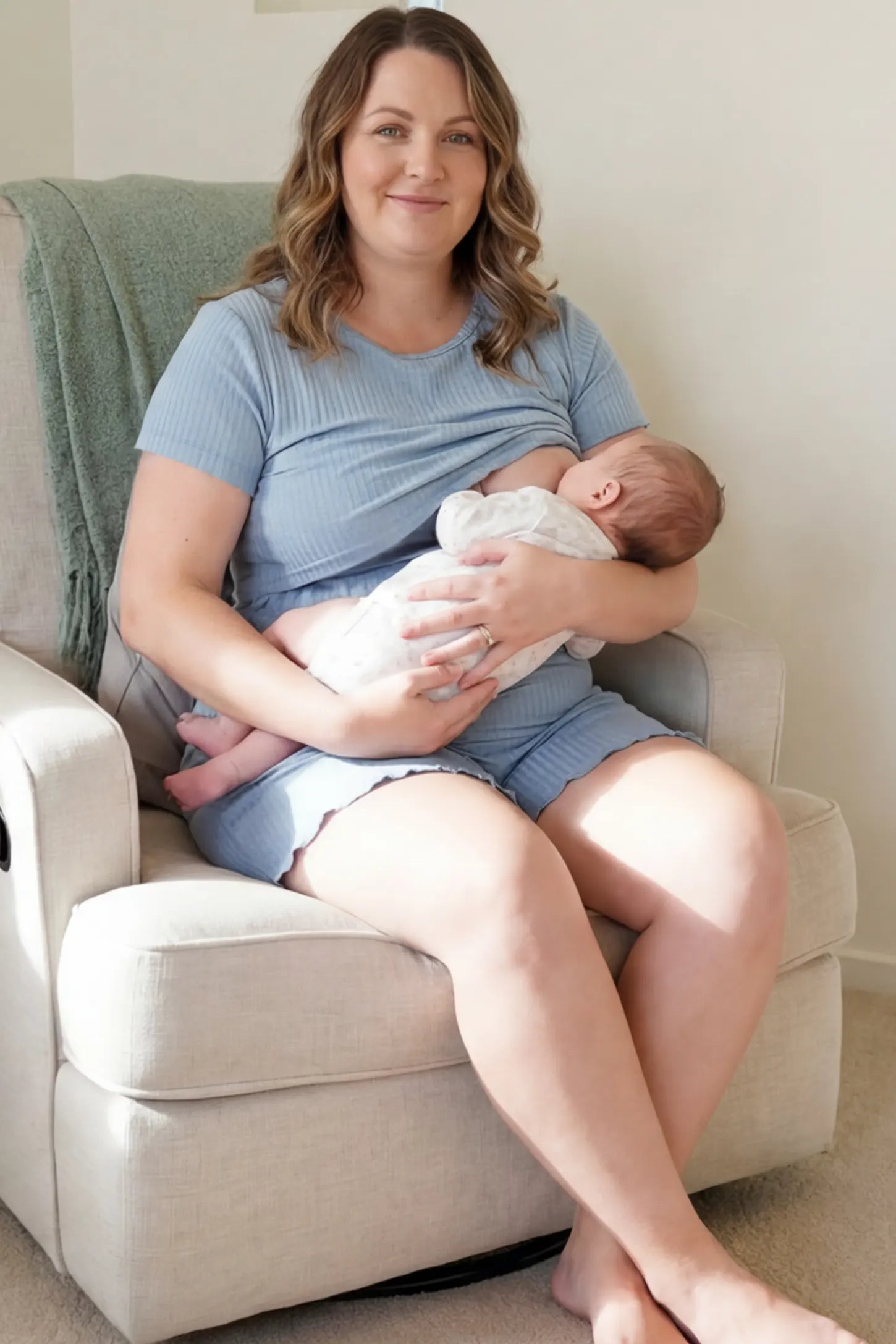 Ribbed Short Sleeve Top & Drawstring Shorts Maternity Nursing Lounge Set Ribbed Maternity and Nursing Pajama Set in blue featuring functional lift-up nursing layers while breastfeeding a newborn, front view.