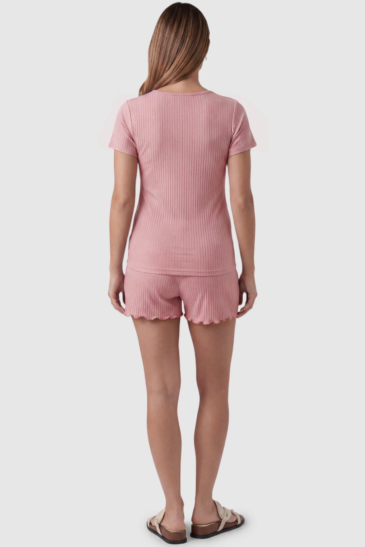 Ribbed Short Sleeve Top & Drawstring Shorts Maternity Nursing Lounge Set Ribbed Short Sleeve Top & Drawstring Shorts Maternity Nursing Lounge Set in Pink featuring seamless back design on a pregnant model, back view.