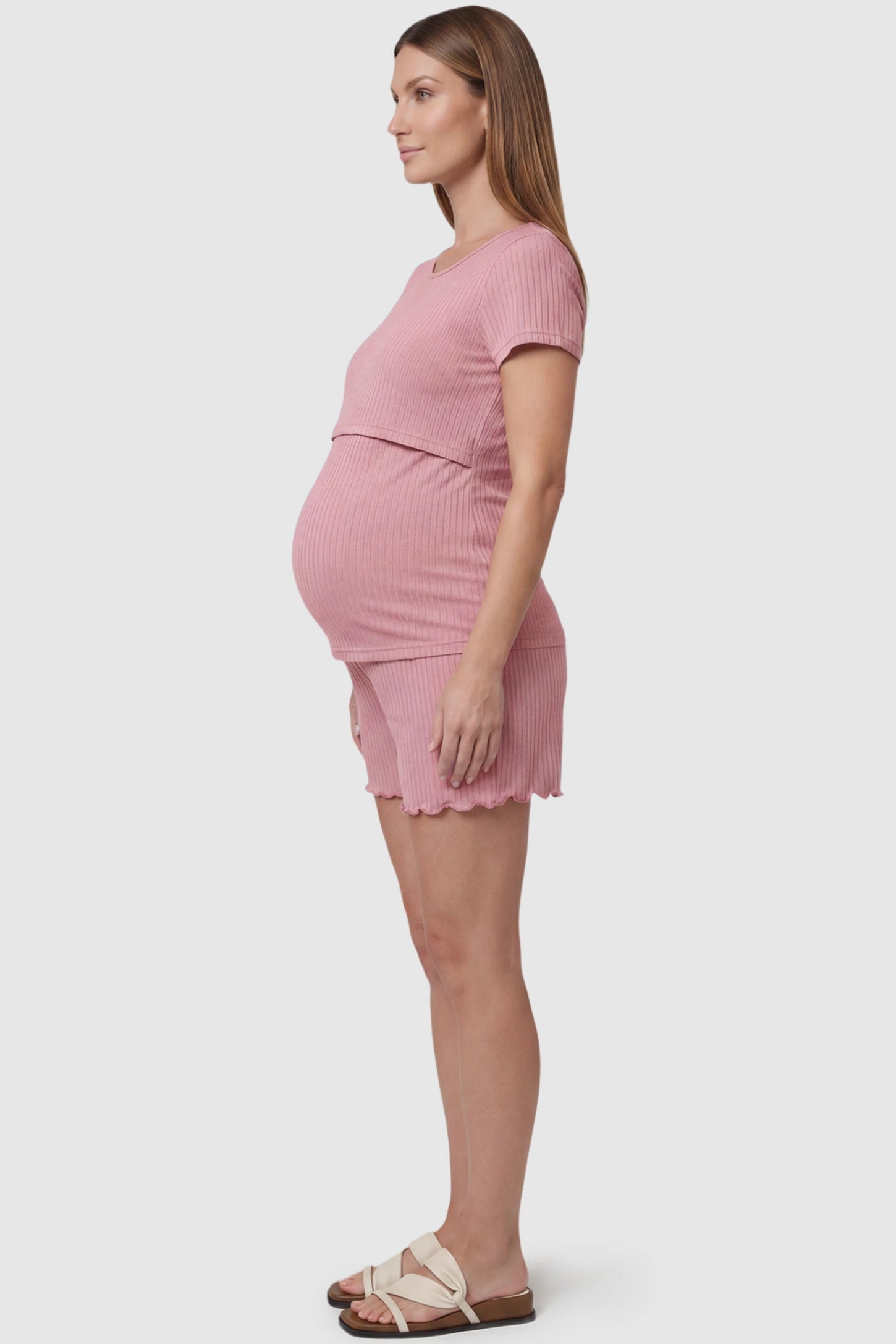 Ribbed Short Sleeve Top & Drawstring Shorts Maternity Nursing Lounge Set Ribbed Short Sleeve Top & Drawstring Shorts Maternity Nursing Lounge Set in pink featuring lift-up nursing layers on a pregnant model, side view.