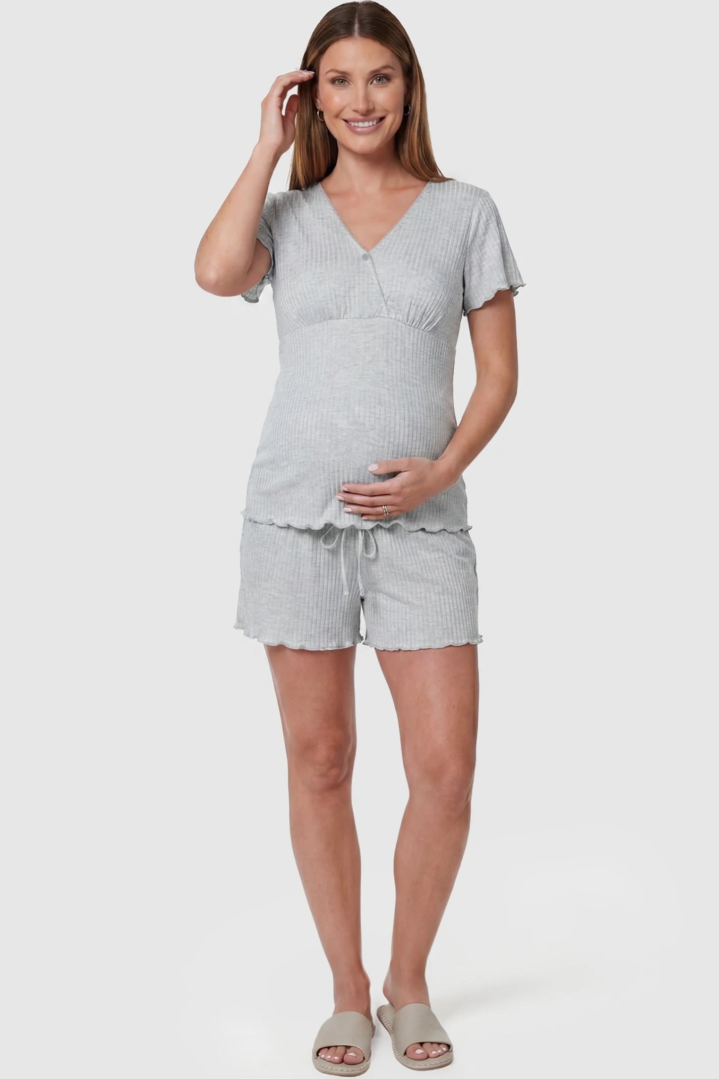 Ribbed Short Sleeve & Drawstring Shorts Maternity Pajama Set Ribbed Short Sleeve & Drawstring Shorts Maternity Pajama Set in Gray featuring a cross-over front with ribbed knit on a pregnant model, front view.