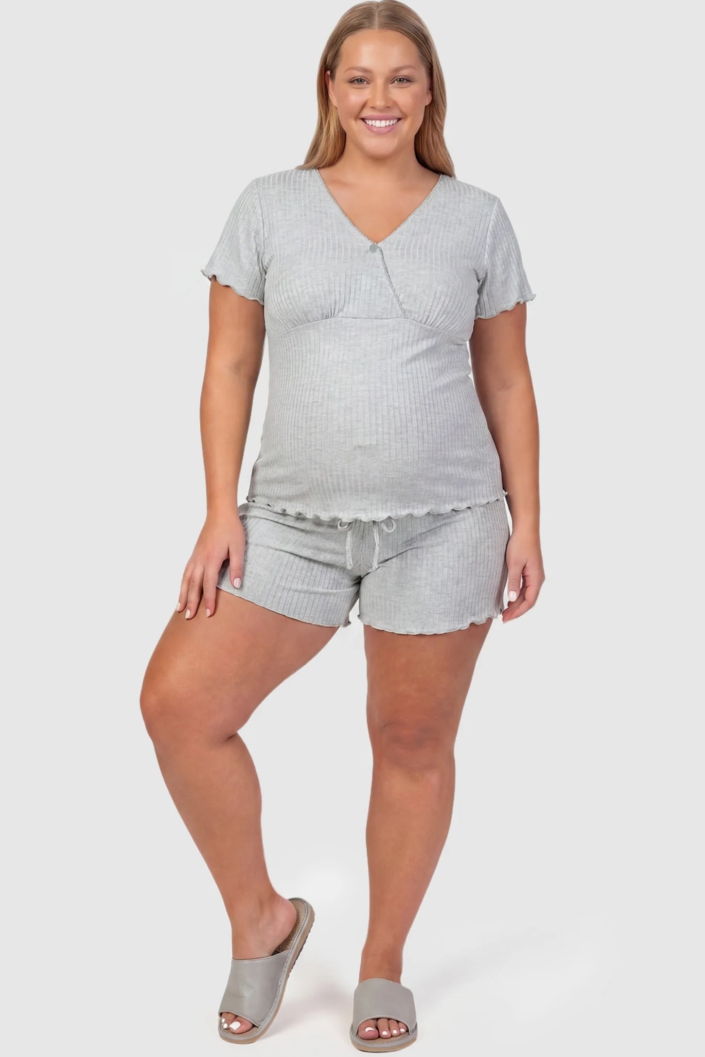 Ribbed Short Sleeve & Drawstring Shorts Maternity Pajama Set Ribbed Short Sleeve & Drawstring Shorts Maternity Pajama Set in Gray featuring a soft ribbed cross-over top on a pregnant model, plus size front view.
