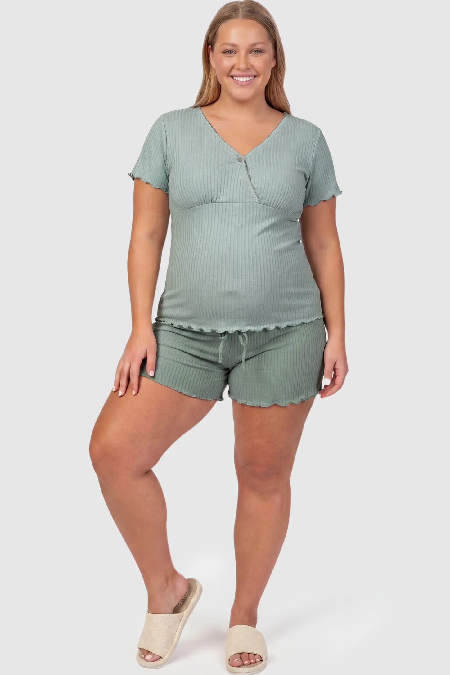 Ribbed Short Sleeve & Drawstring Shorts Maternity Pajama Set Ribbed Short Sleeve & Drawstring Shorts Maternity Pajama Set in Green featuring a soft ribbed knit with drawstring waist on a pregnant model, plus size front view.