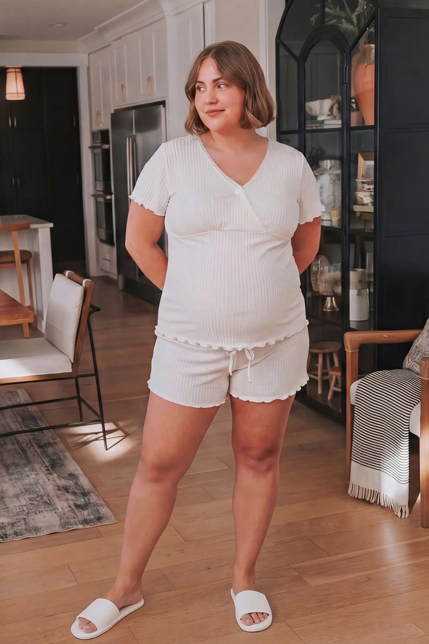 Ribbed Short Sleeve & Drawstring Shorts Maternity Pajama Set Ribbed Short Sleeve & Drawstring Shorts Maternity Pajama Set in White featuring a relaxed drawstring short on a pregnant model, UGC view.