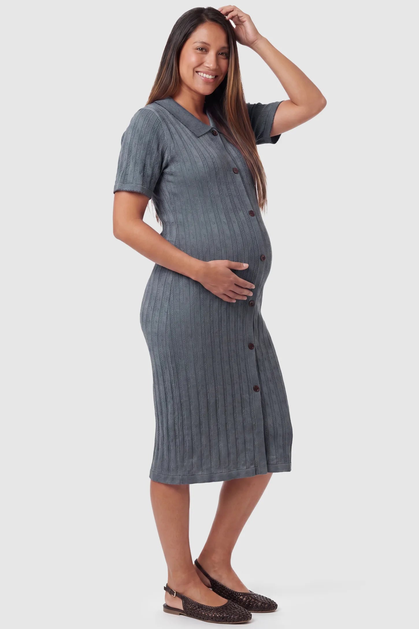 Ribbed Knit Collared Neck Maternity Midi Dress Ribbed Knit Collared Neck Maternity Midi Dress in Gray featuring short sleeves and soft knit high stretch fabric on a pregnant model, side view.