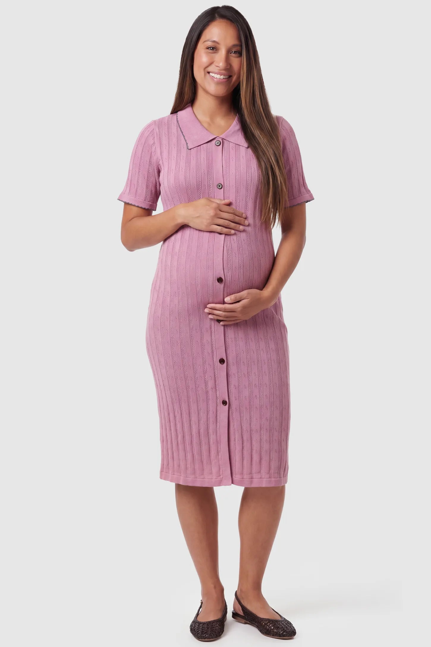 Ribbed Knit Collared Neck Maternity Midi Dress Ribbed Knit Collared Neck Maternity Midi Dress in Pink featuring short sleeves and soft knit high stretch fabric on a pregnant model, front view.