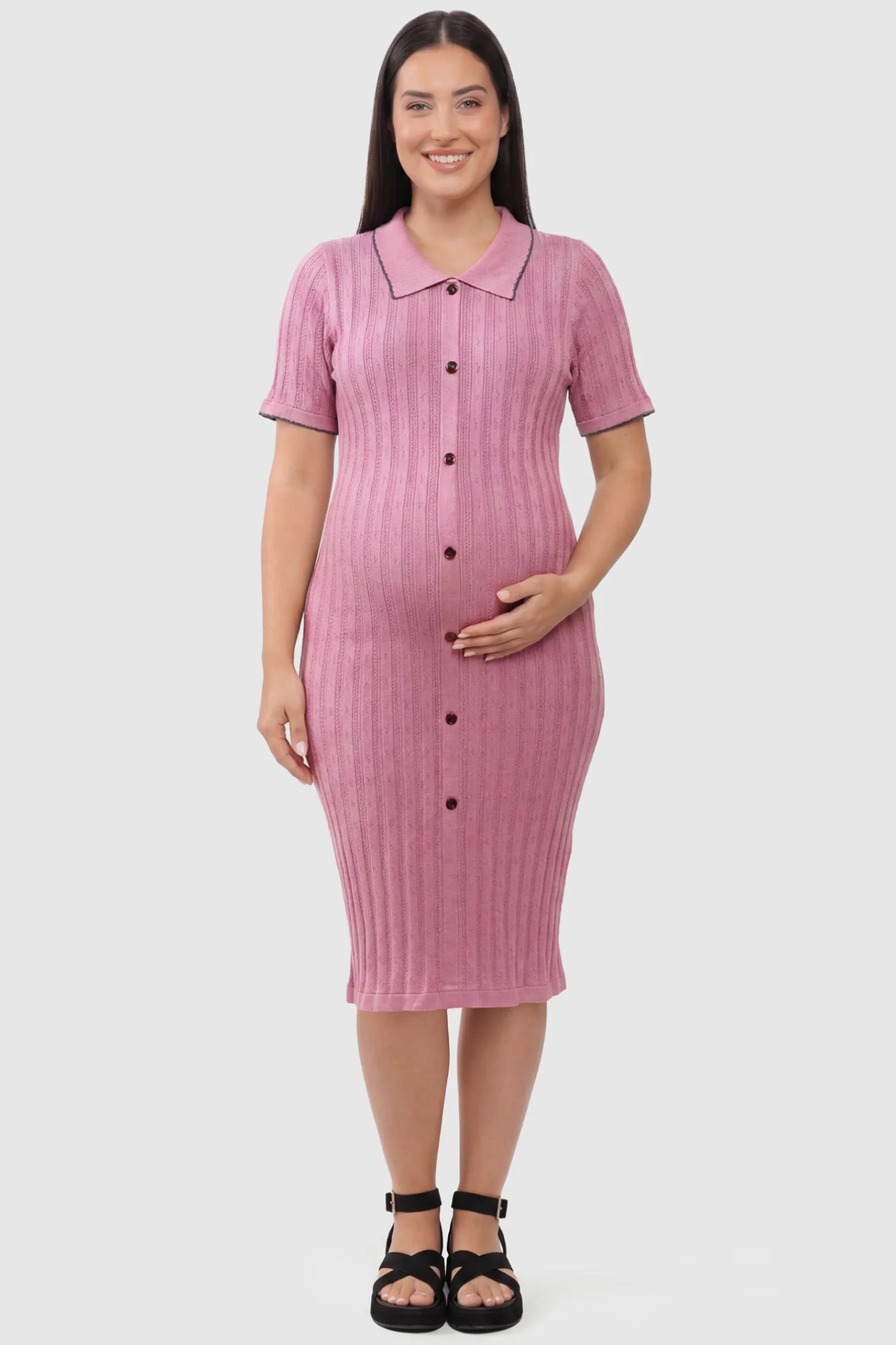 Ribbed Knit Collared Neck Maternity Midi Dress Ribbed Knit Collared Neck Maternity Midi Dress in Pink featuring short sleeves and soft knit high stretch fabric on a plus size pregnant model, front view.
