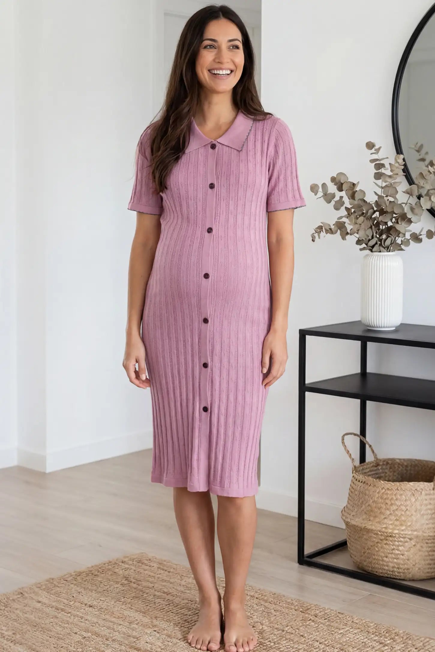 Ribbed Knit Collared Neck Maternity Midi Dress Ribbed Knit Collared Neck Maternity Midi Dress in Pink featuring short sleeves and soft knit high stretch fabric on a pregnant model at home, front view.