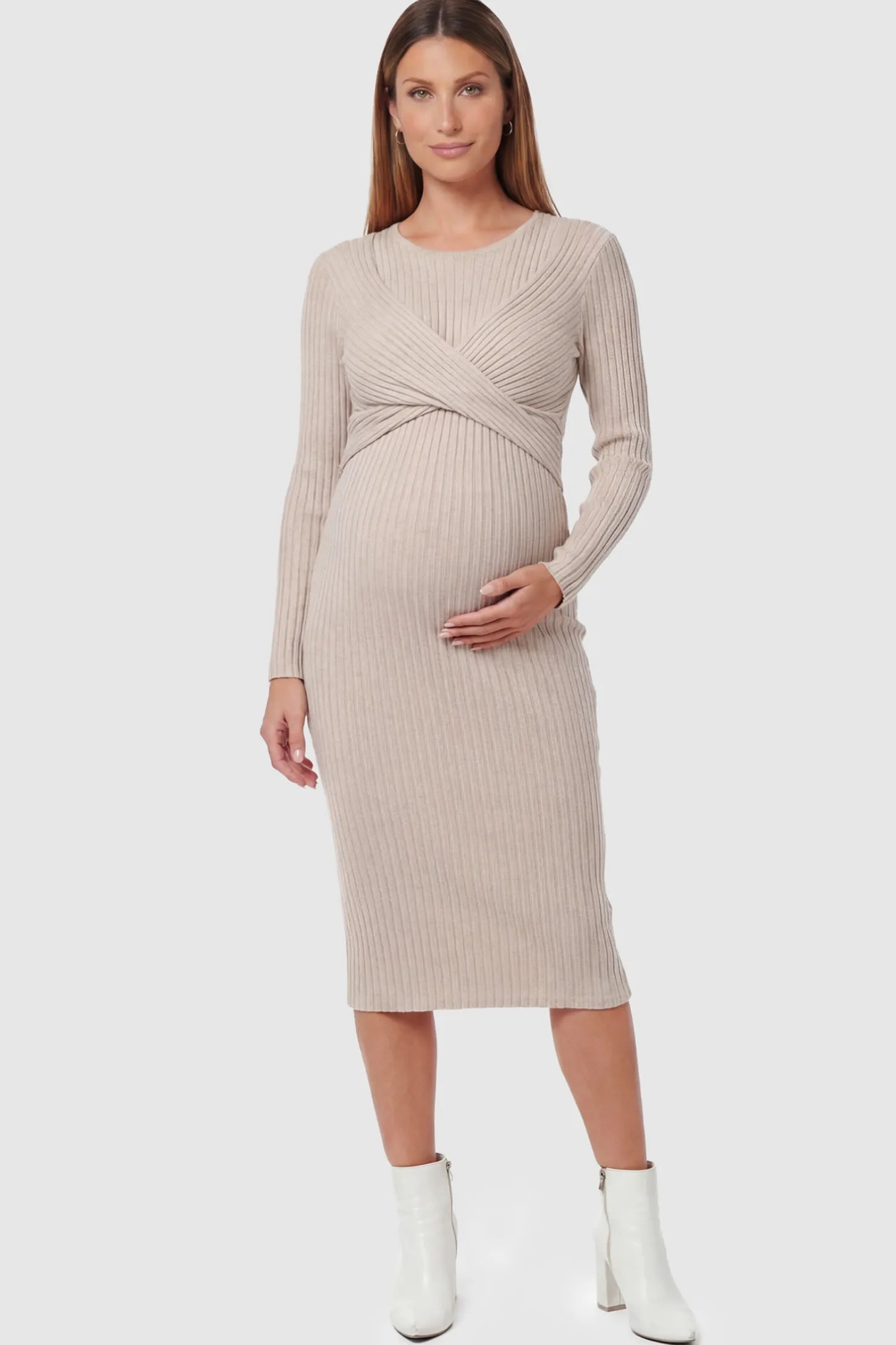 Ribbed Knit Cross Front Fitted Maternity Midi Dress Ribbed Knit Cross Front Fitted Maternity Midi Dress in Apricot featuring a supportive criss-cross bodice on a pregnant model.