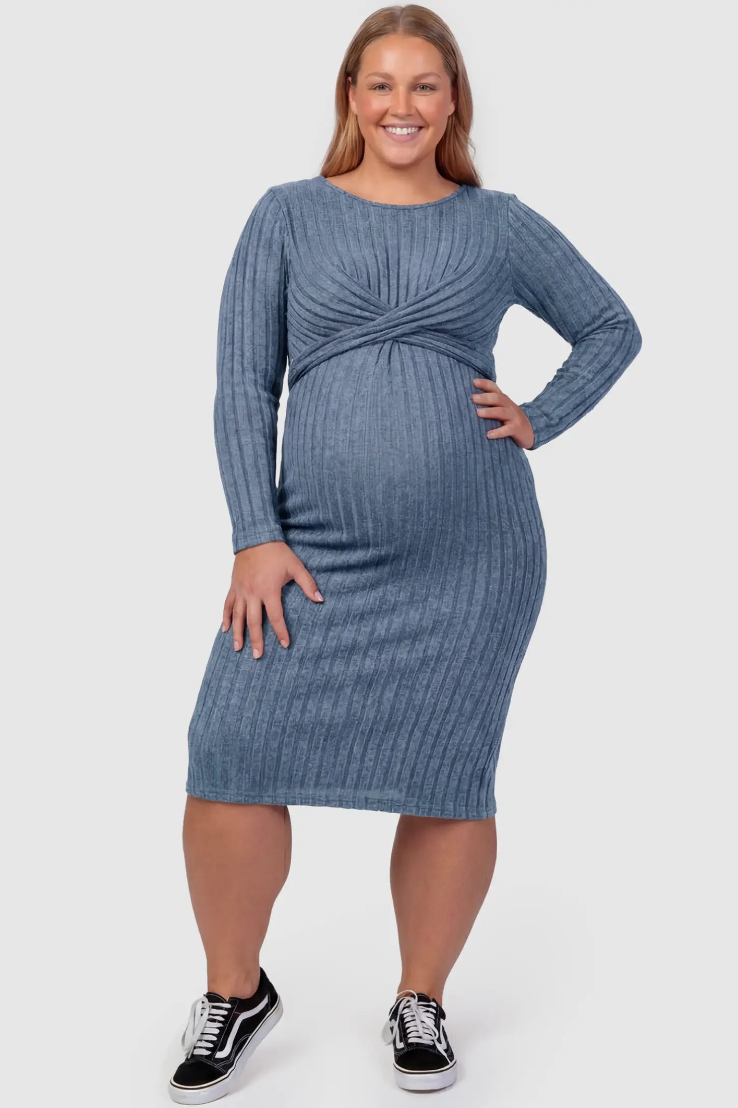 Ribbed Knit Cross Front Fitted Maternity Midi Dress Ribbed Knit Cross Front Fitted Maternity Midi Dress in Blue featuring a supportive criss-cross bodice on a plus size pregnant model, front view.