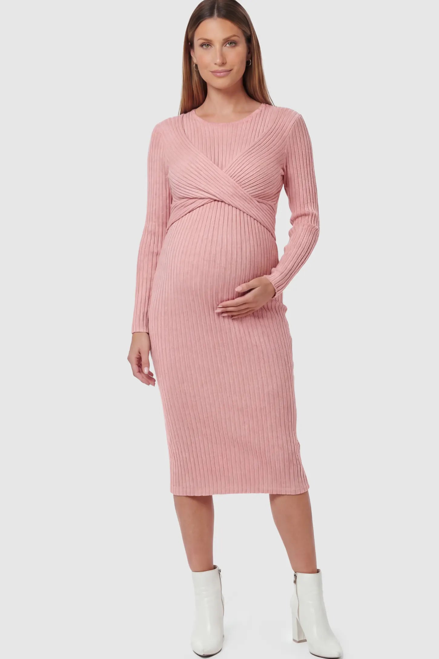 Ribbed Knit Cross Front Fitted Maternity Midi Dress Ribbed Knit Cross Front Fitted Maternity Midi Dress in Pink featuring a supportive criss-cross bodice on a pregnant model.