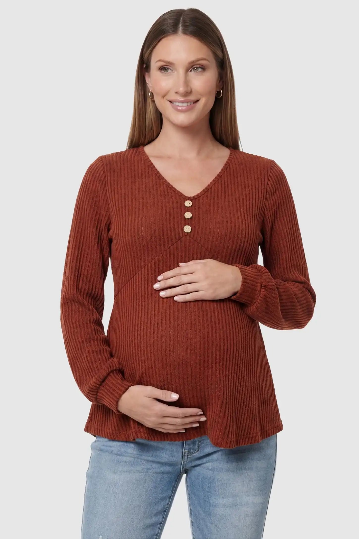 Ribbed Knit Empire Waist Maternity Top in brown featuring a v-neckline and ribbed knit texture on a pregnant model front view.