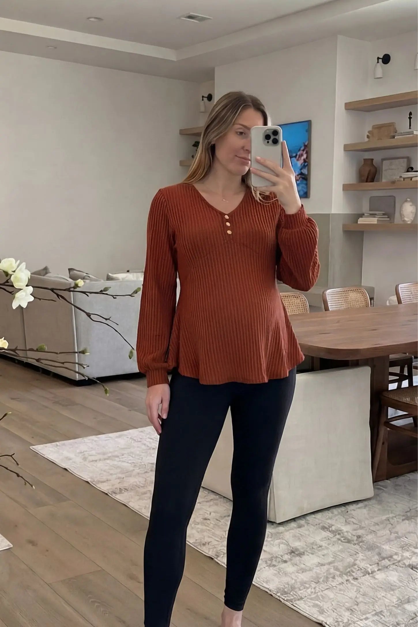 Ribbed Knit Empire Waist Maternity Top Ribbed Knit Empire Waist Maternity Top in brown featuring a v-neckline and ribbed knit texture on a pregnant model front view.