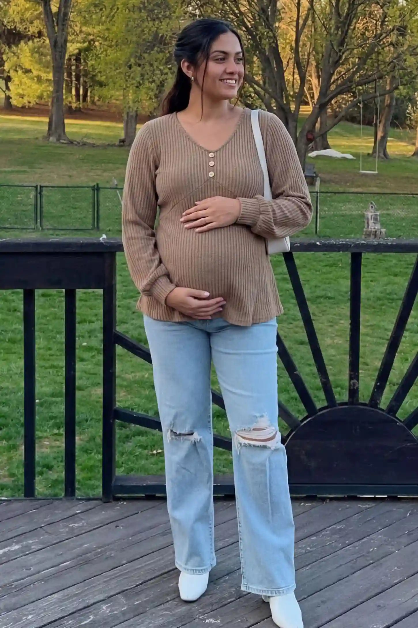 Ribbed Knit Empire Waist Maternity Top Ribbed Knit Empire Waist Maternity Top in khaki featuring a v-neckline and ribbed knit texture on a pregnant model front view.