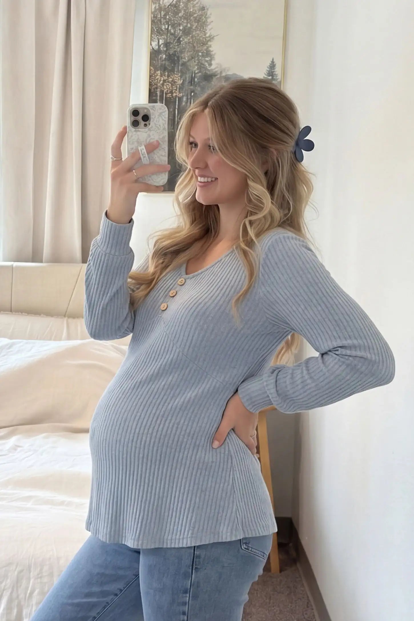 Ribbed Knit Empire Waist Maternity Top Ribbed Knit Empire Waist Maternity Top in light blue featuring a v-neckline and ribbed knit texture on a pregnant model side view.